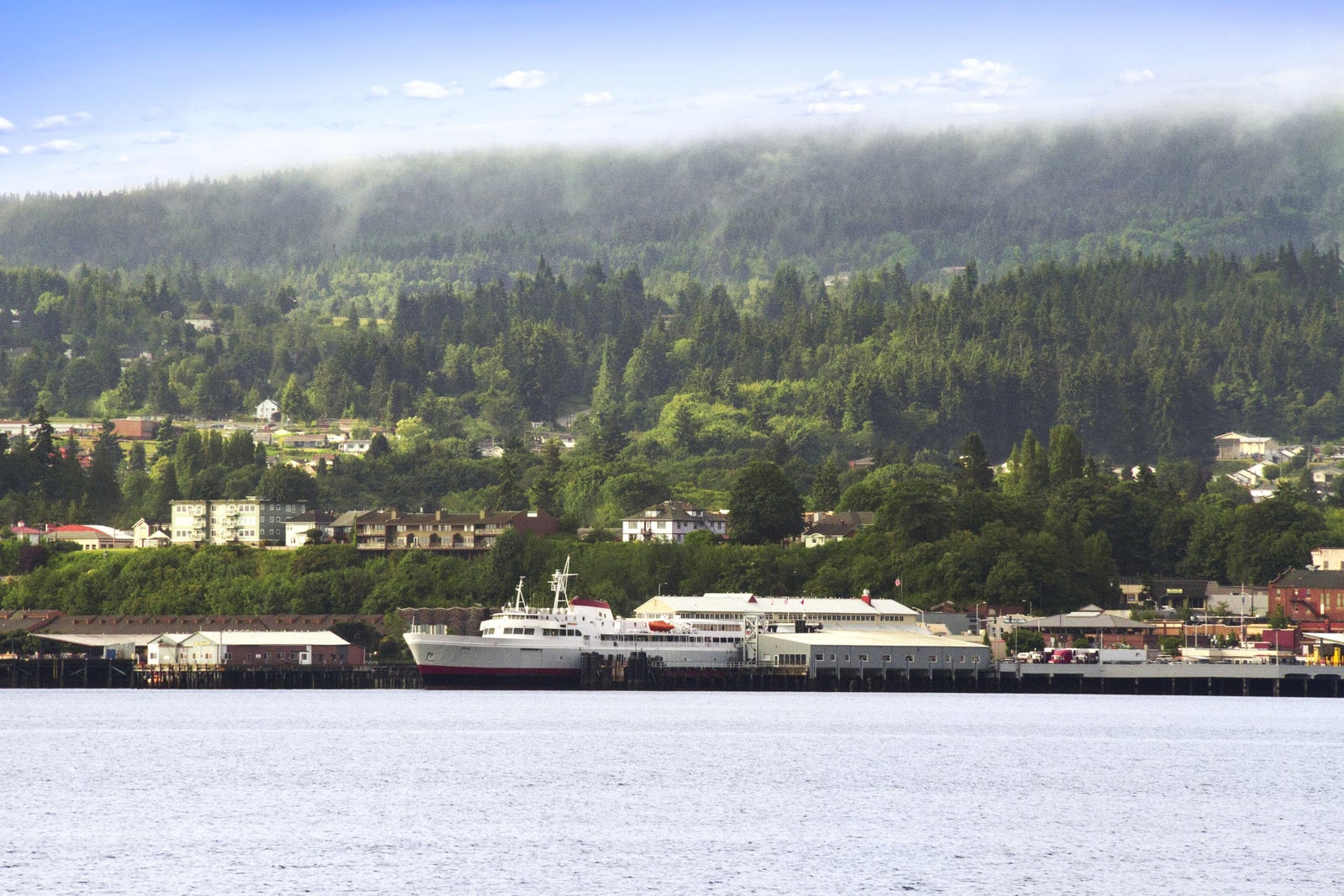 Ferry Ship with City In Background