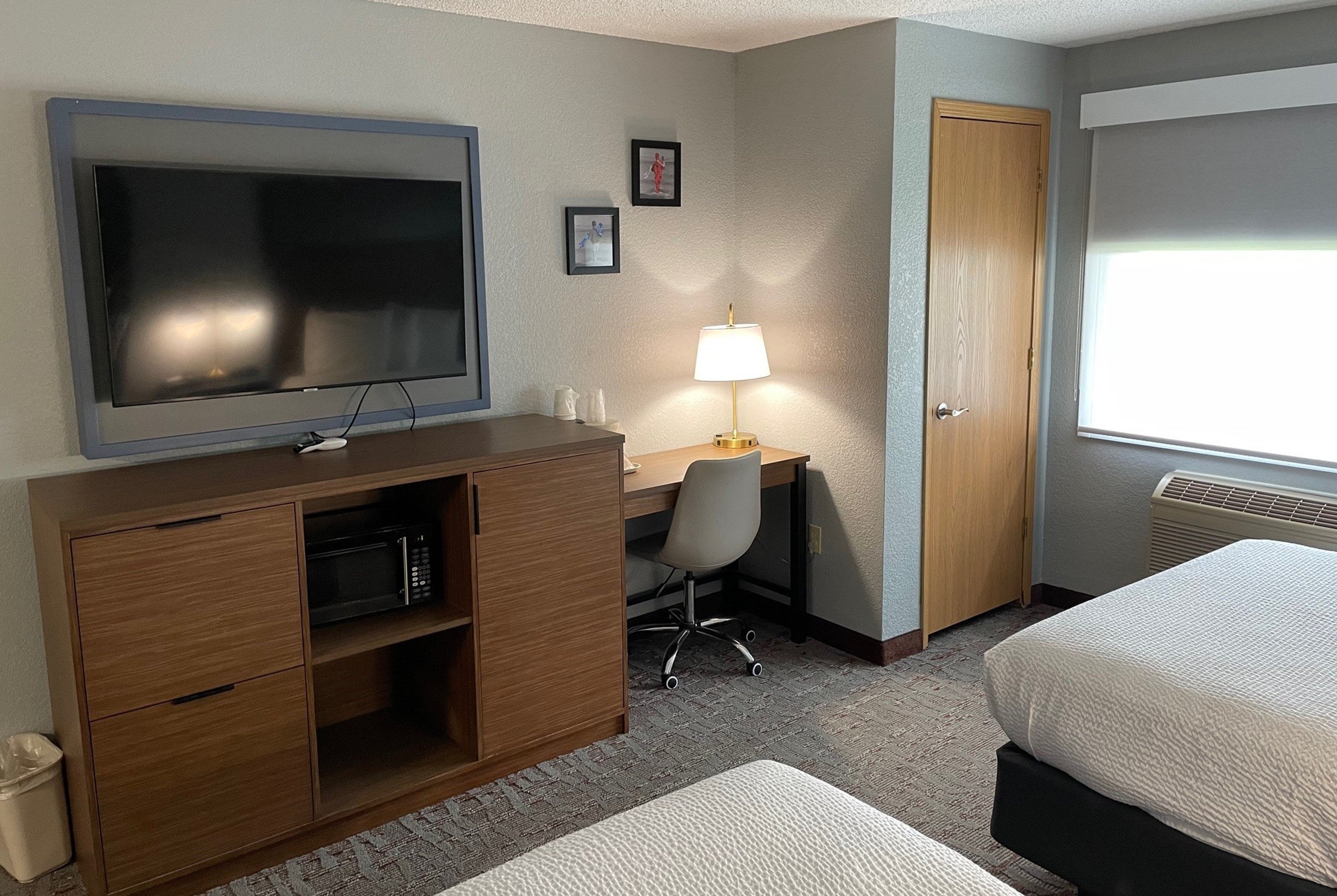 Guest room at the AmericInn by Wyndham Ankeny/Des Moines in Ankeny, Iowa