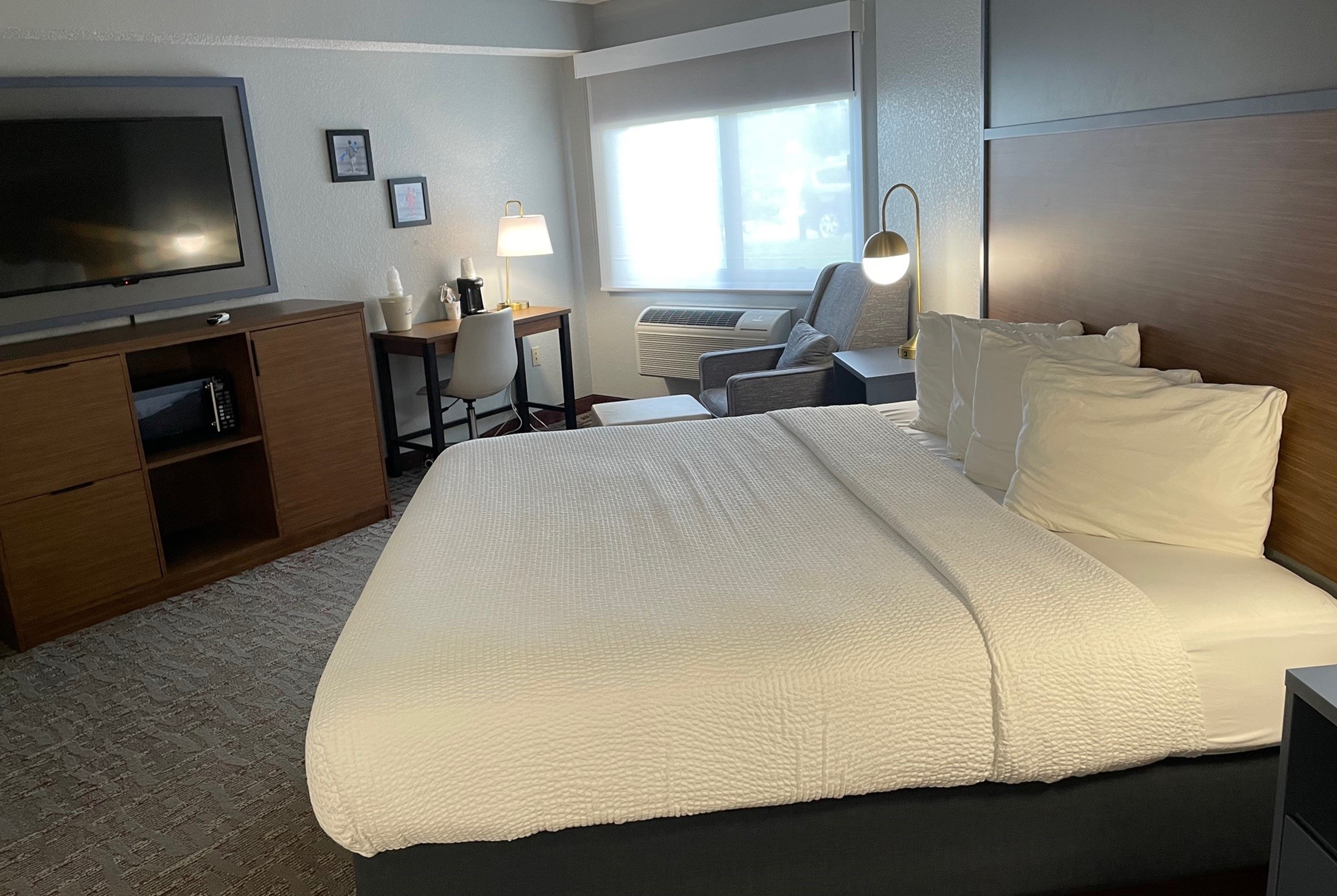 Guest room at the AmericInn by Wyndham Ankeny/Des Moines in Ankeny, Iowa