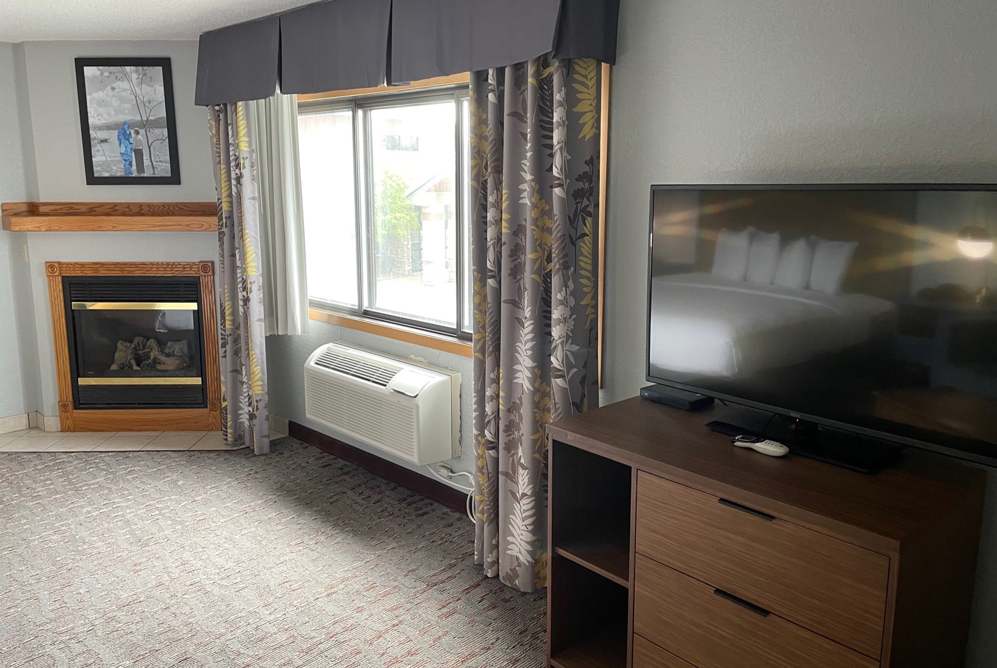 Guest room at the AmericInn by Wyndham Ankeny/Des Moines in Ankeny, Iowa