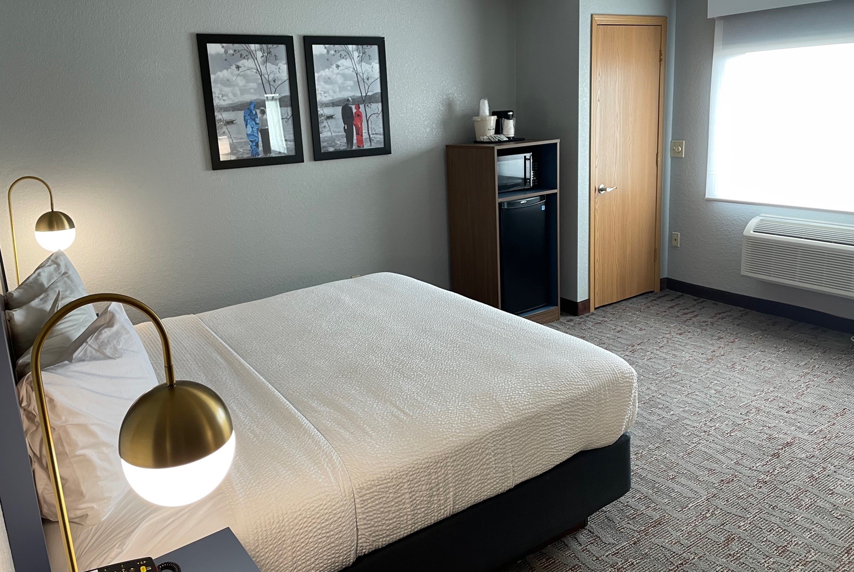 Guest room at the AmericInn by Wyndham Ankeny/Des Moines in Ankeny, Iowa