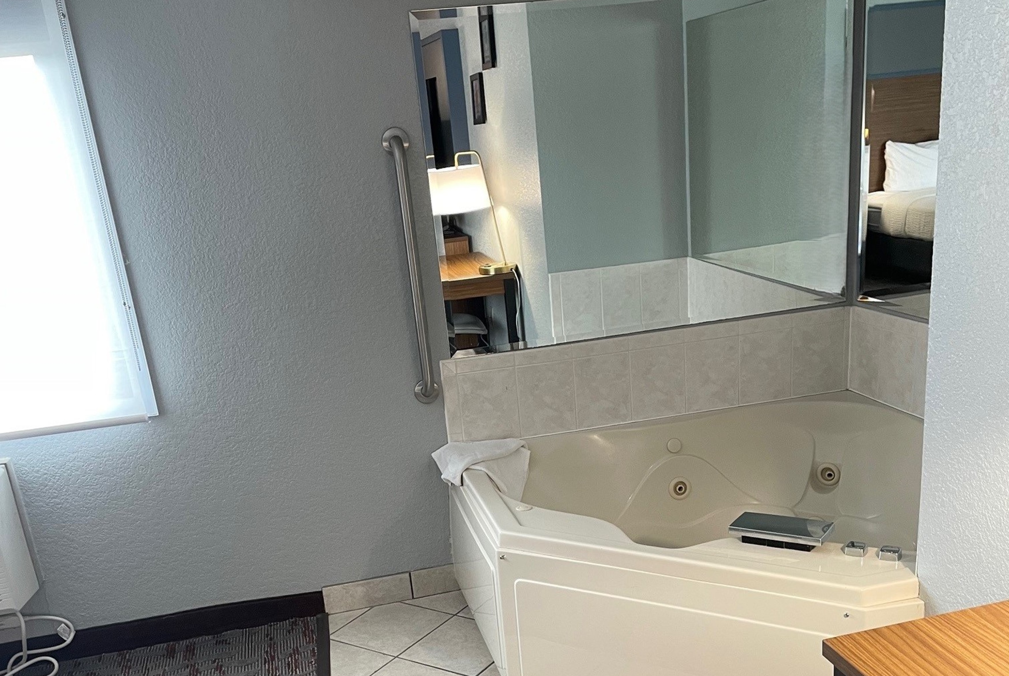 Guest room at the AmericInn by Wyndham Ankeny/Des Moines in Ankeny, Iowa