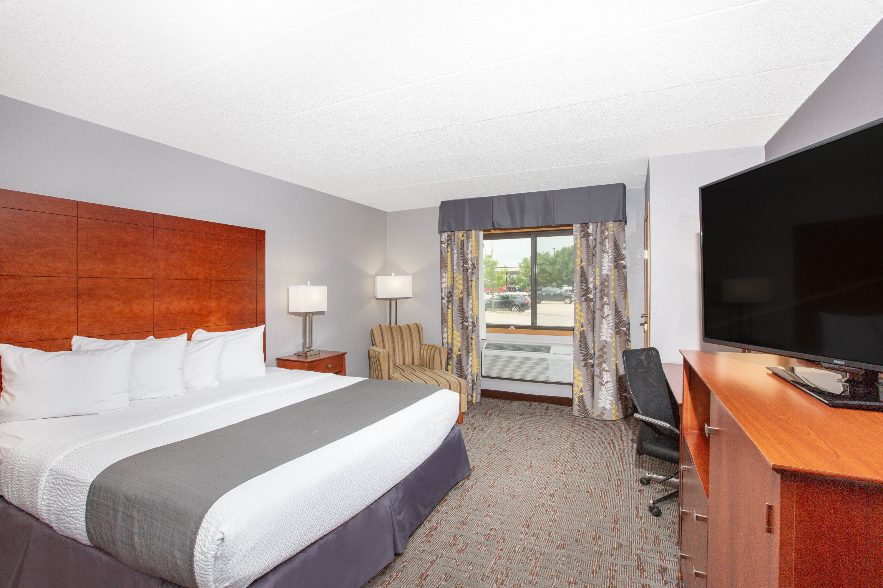 Guest room at the AmericInn by Wyndham Ankeny/Des Moines in Ankeny, Iowa