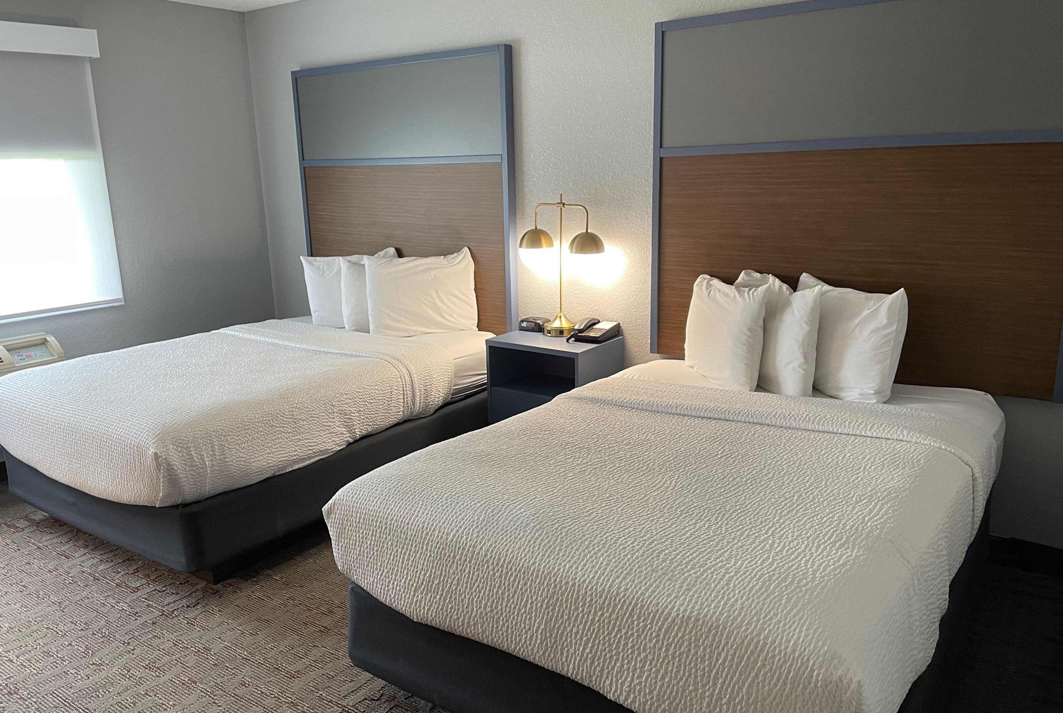 Guest room at the AmericInn by Wyndham Ankeny/Des Moines in Ankeny, Iowa