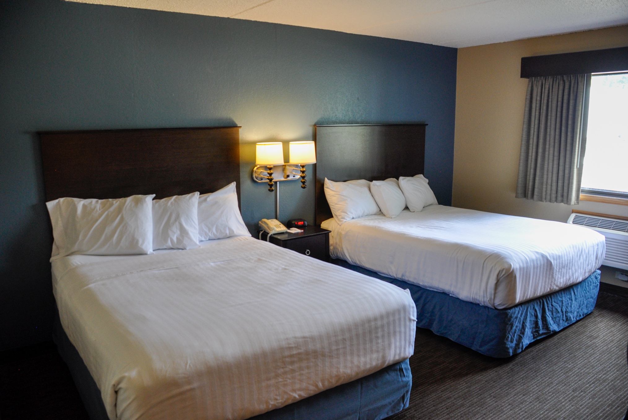 Guest room at the AmericInn by Wyndham Clear Lake in Clear Lake, Iowa