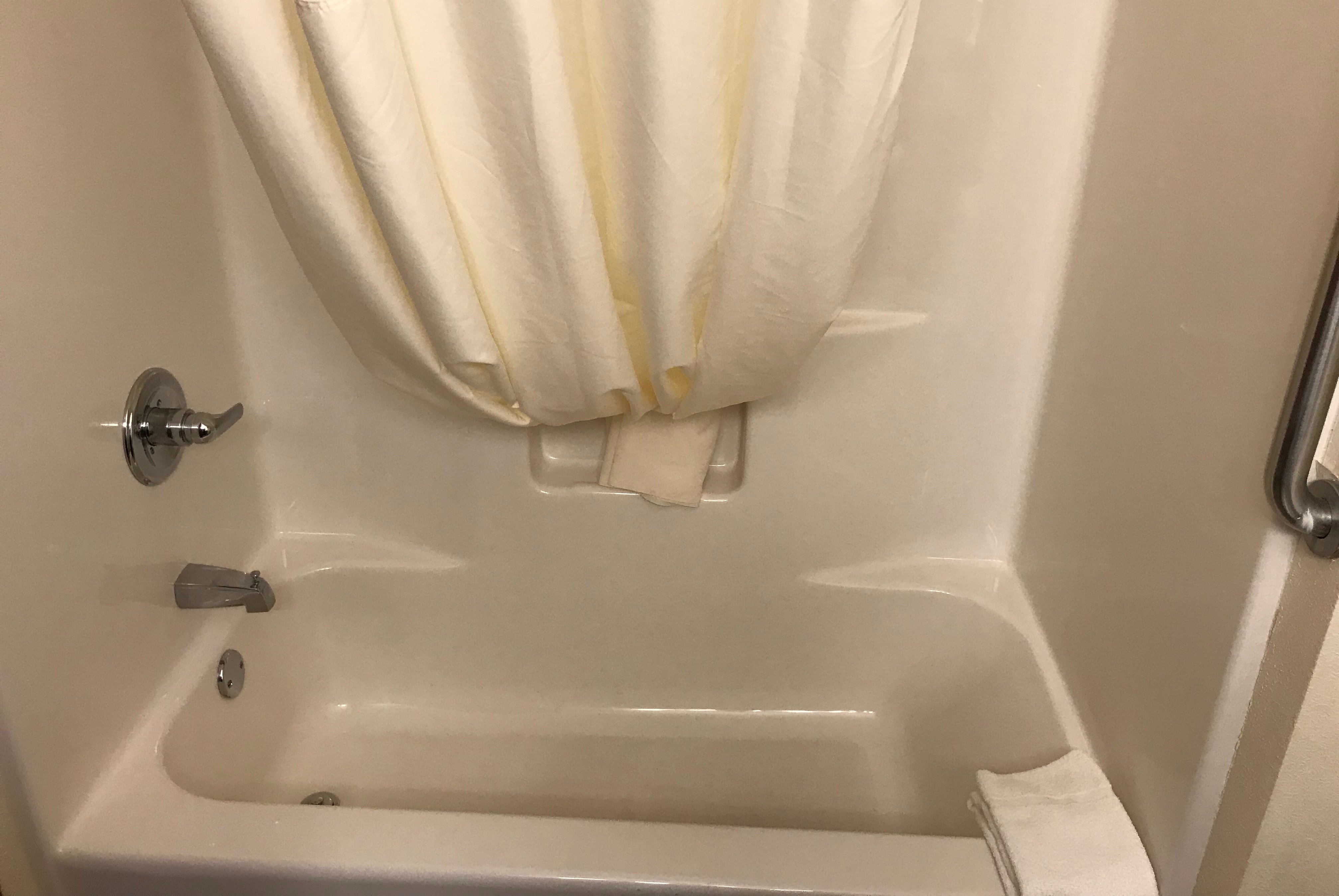 Guest room bath at the AmericInn by Wyndham Maquoketa in Maquoketa, Iowa