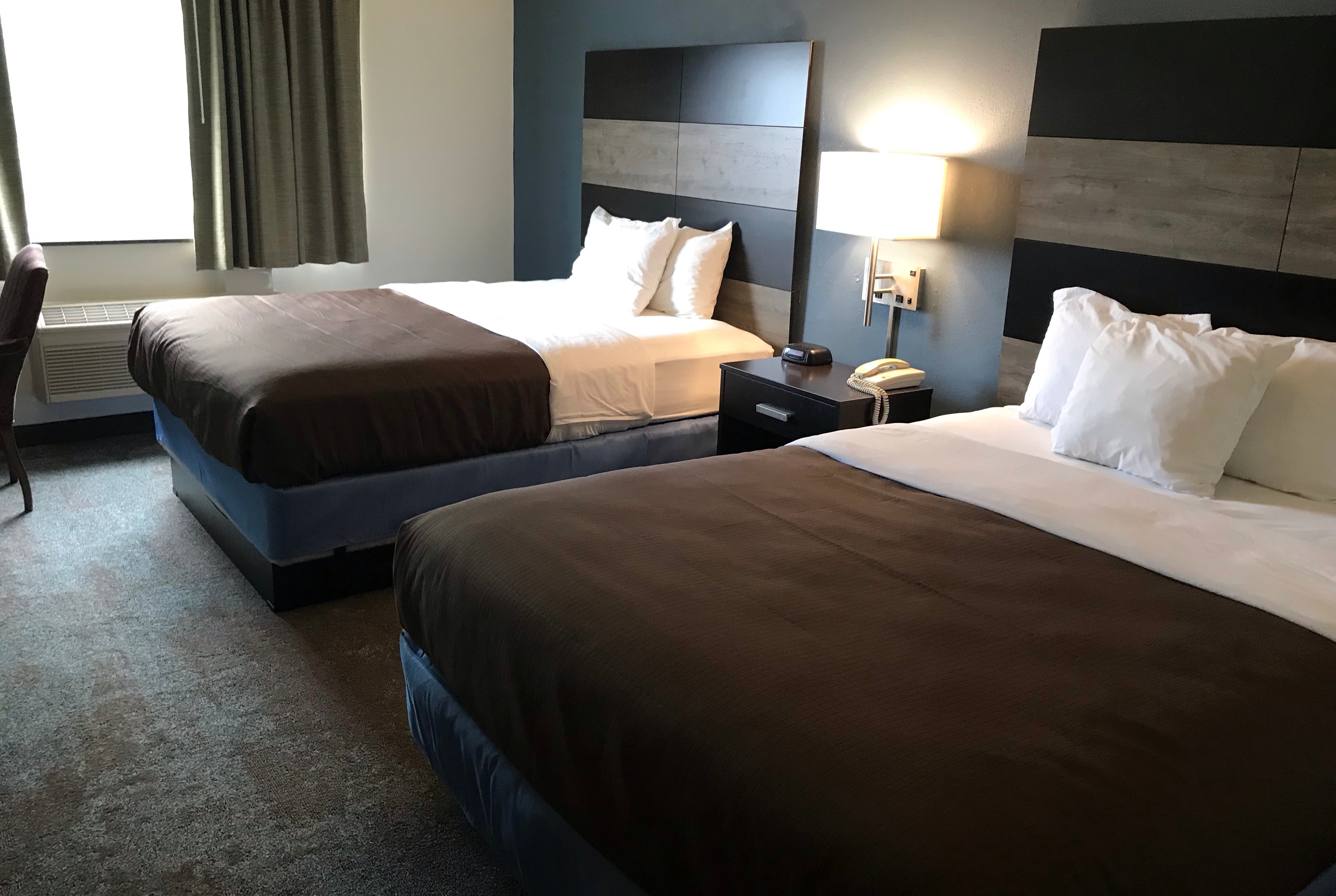 Guest room at the AmericInn by Wyndham Maquoketa in Maquoketa, Iowa