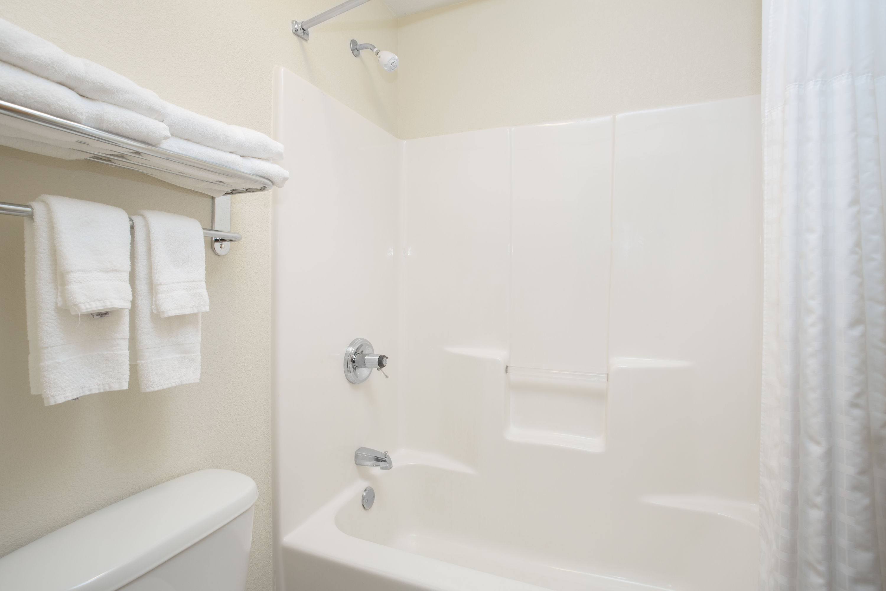 Guest room bath at the AmericInn by Wyndham Mount Pleasant in Mount Pleasant, Iowa