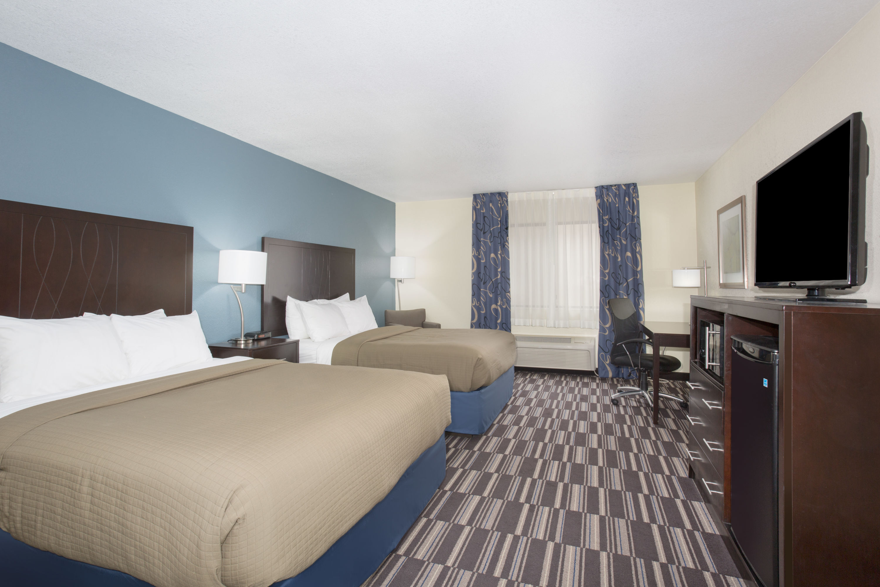 Guest room at the AmericInn by Wyndham Mount Pleasant in Mount Pleasant, Iowa
