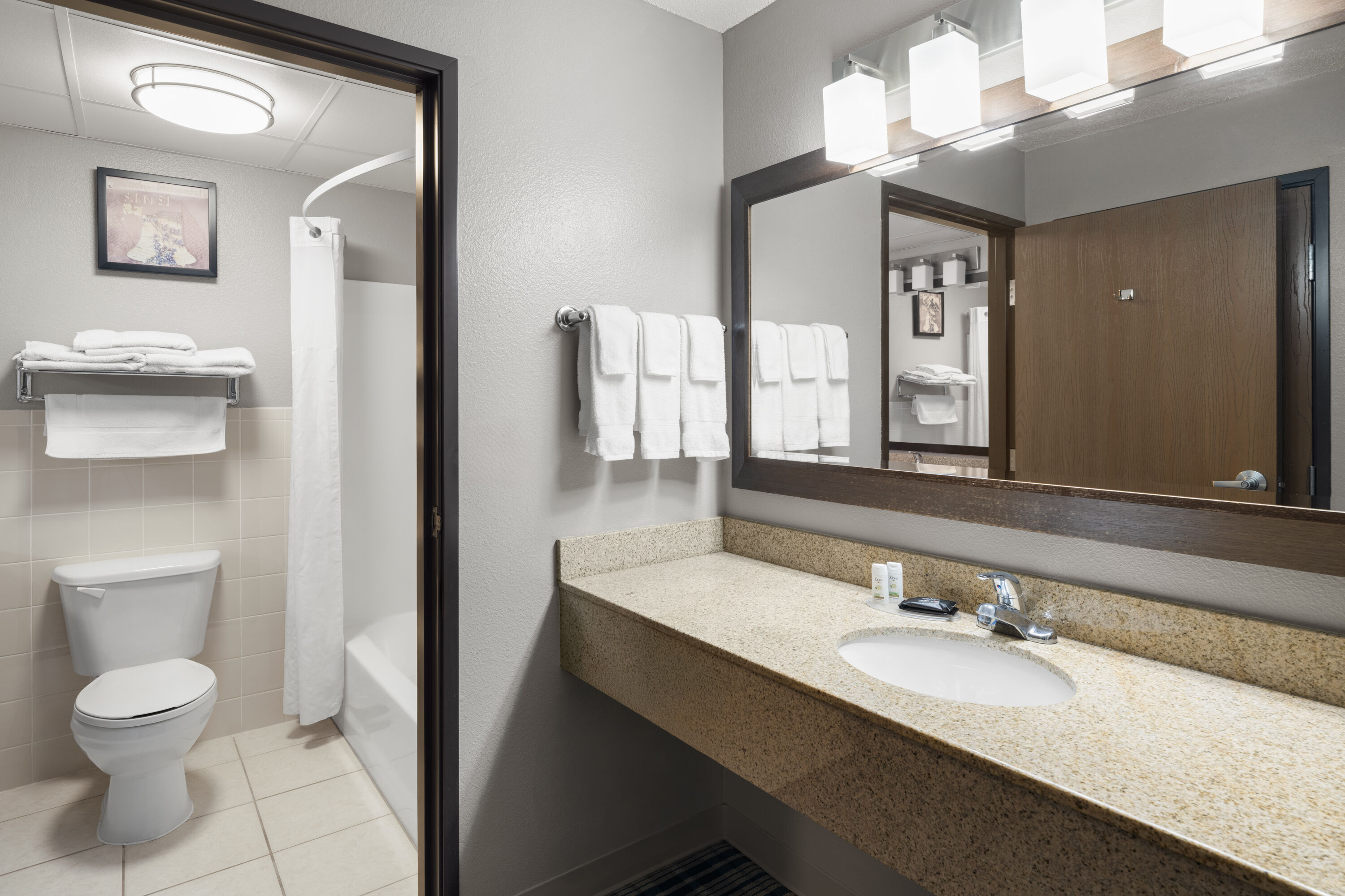 Guest room bath at the AmericInn by Wyndham Muscatine in Muscatine, Iowa