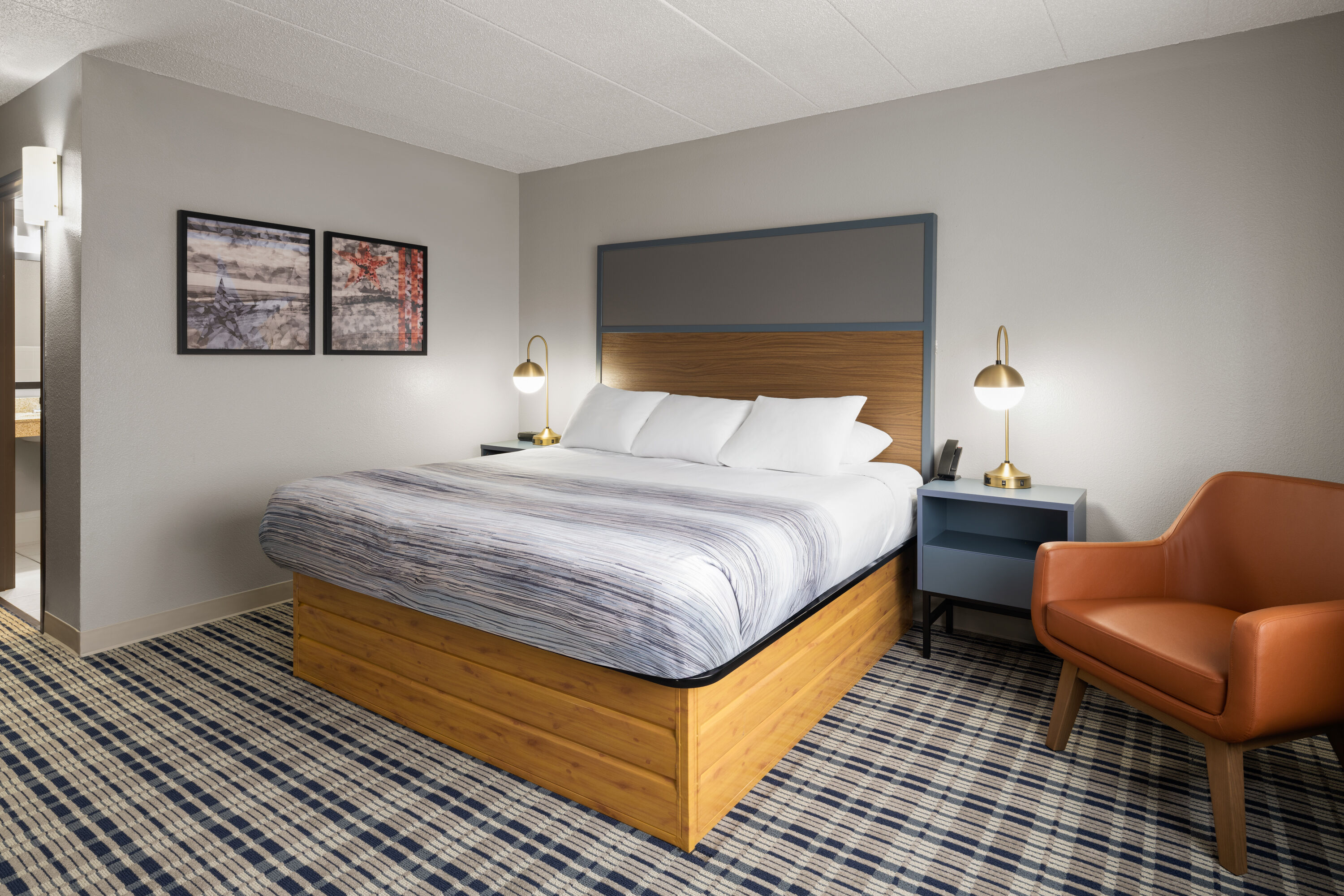 Guest room at the AmericInn by Wyndham Muscatine in Muscatine, Iowa