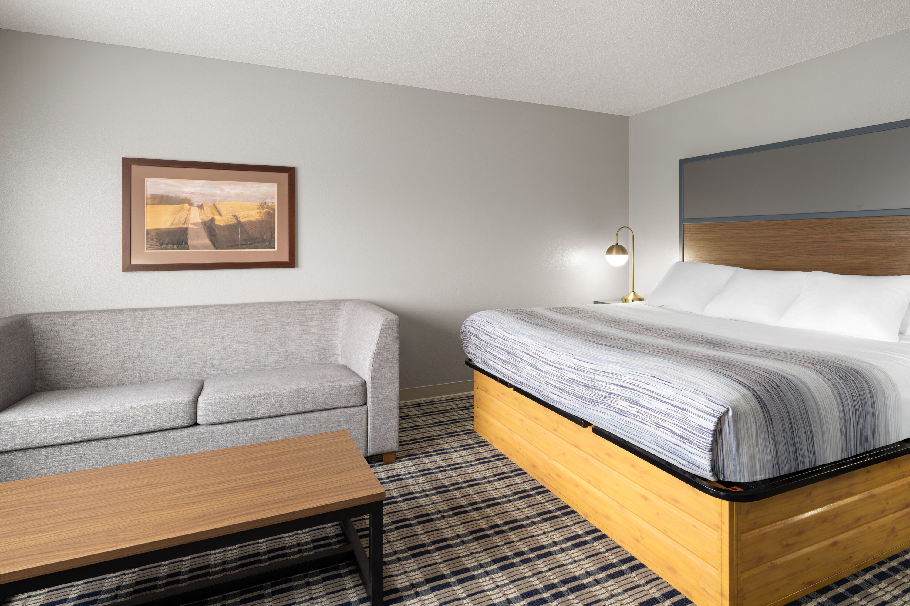 Guest room at the AmericInn by Wyndham Muscatine in Muscatine, Iowa