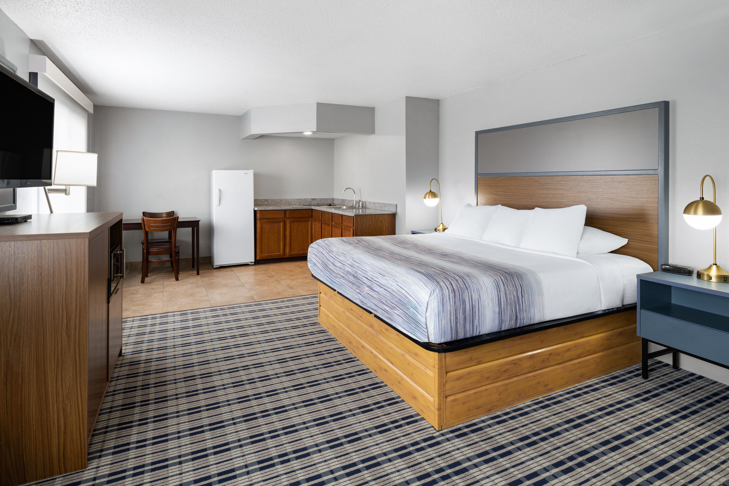 Guest room at the AmericInn by Wyndham Muscatine in Muscatine, Iowa