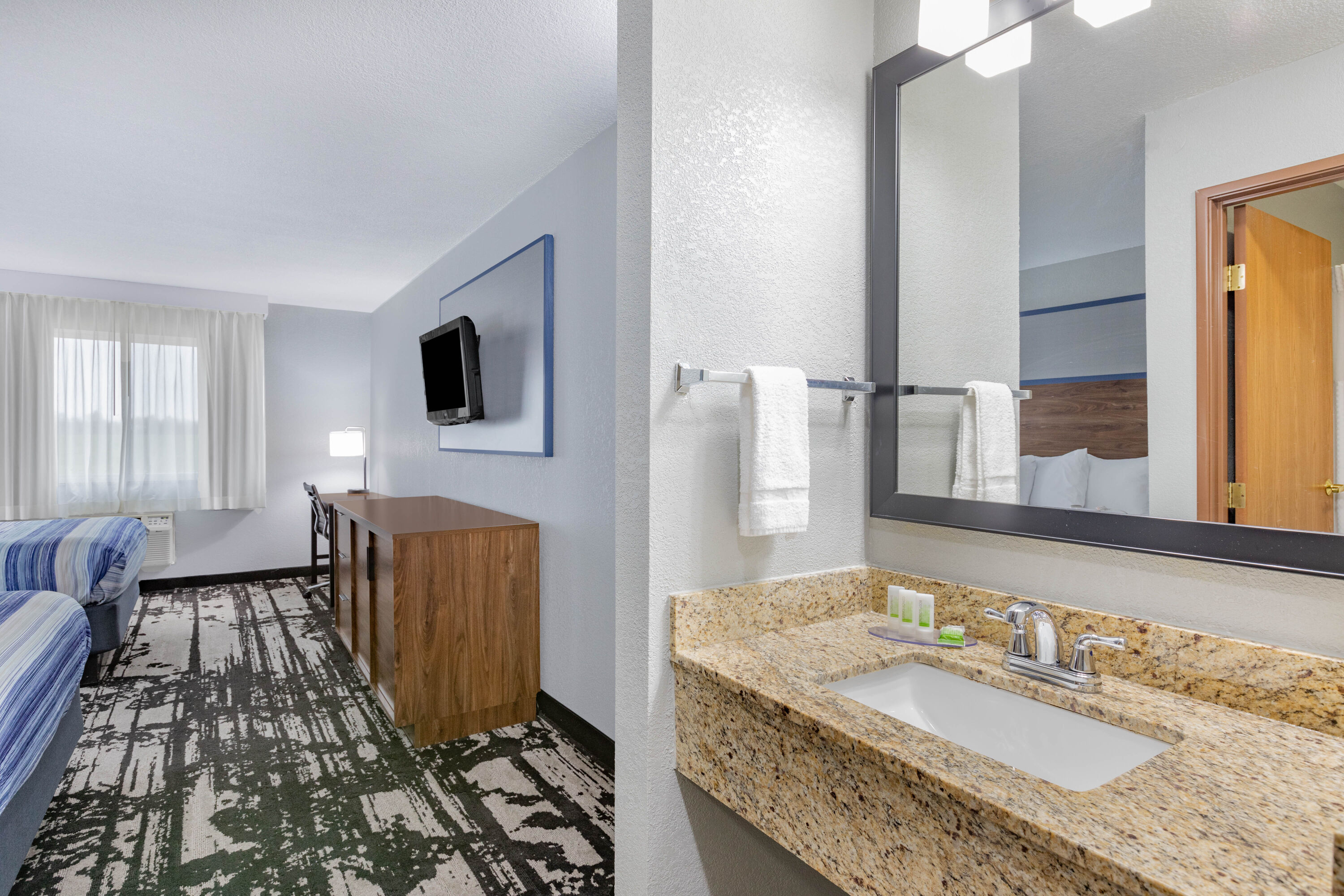 Guest room bath at the AmericInn by Wyndham Pella in Pella, Iowa