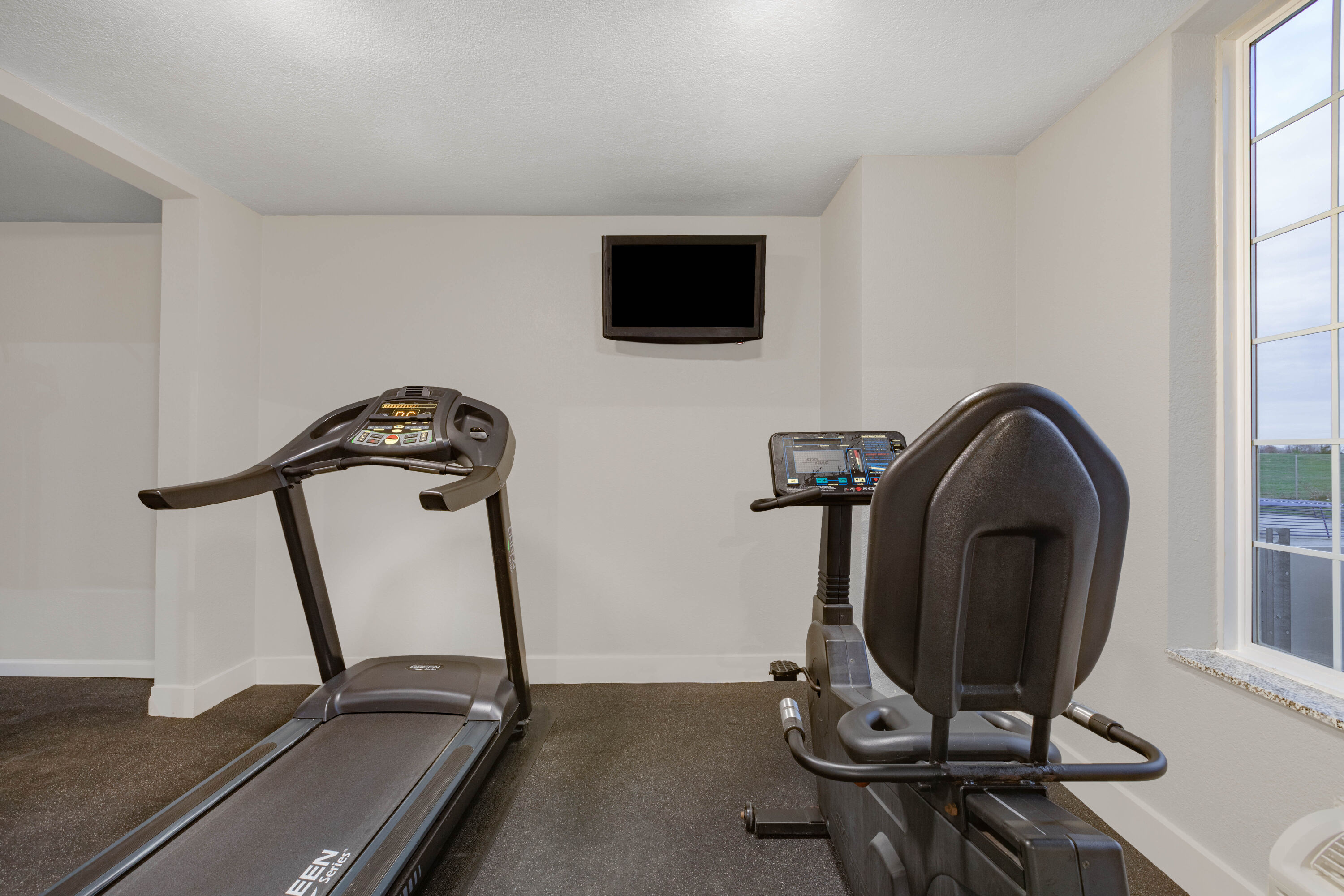 Fitness room at AmericInn by Wyndham Pella in Pella, Iowa