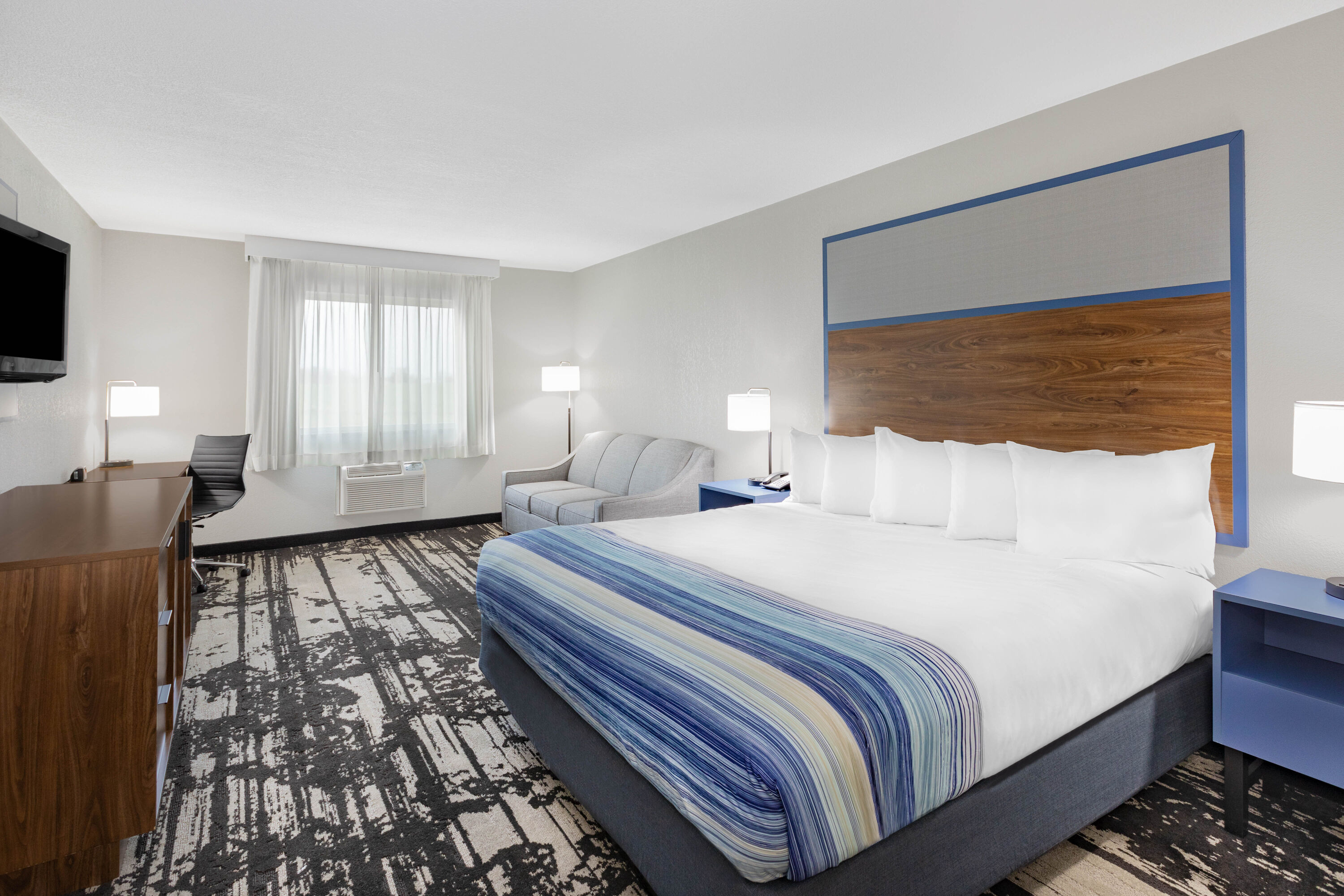 Guest room at the AmericInn by Wyndham Pella in Pella, Iowa