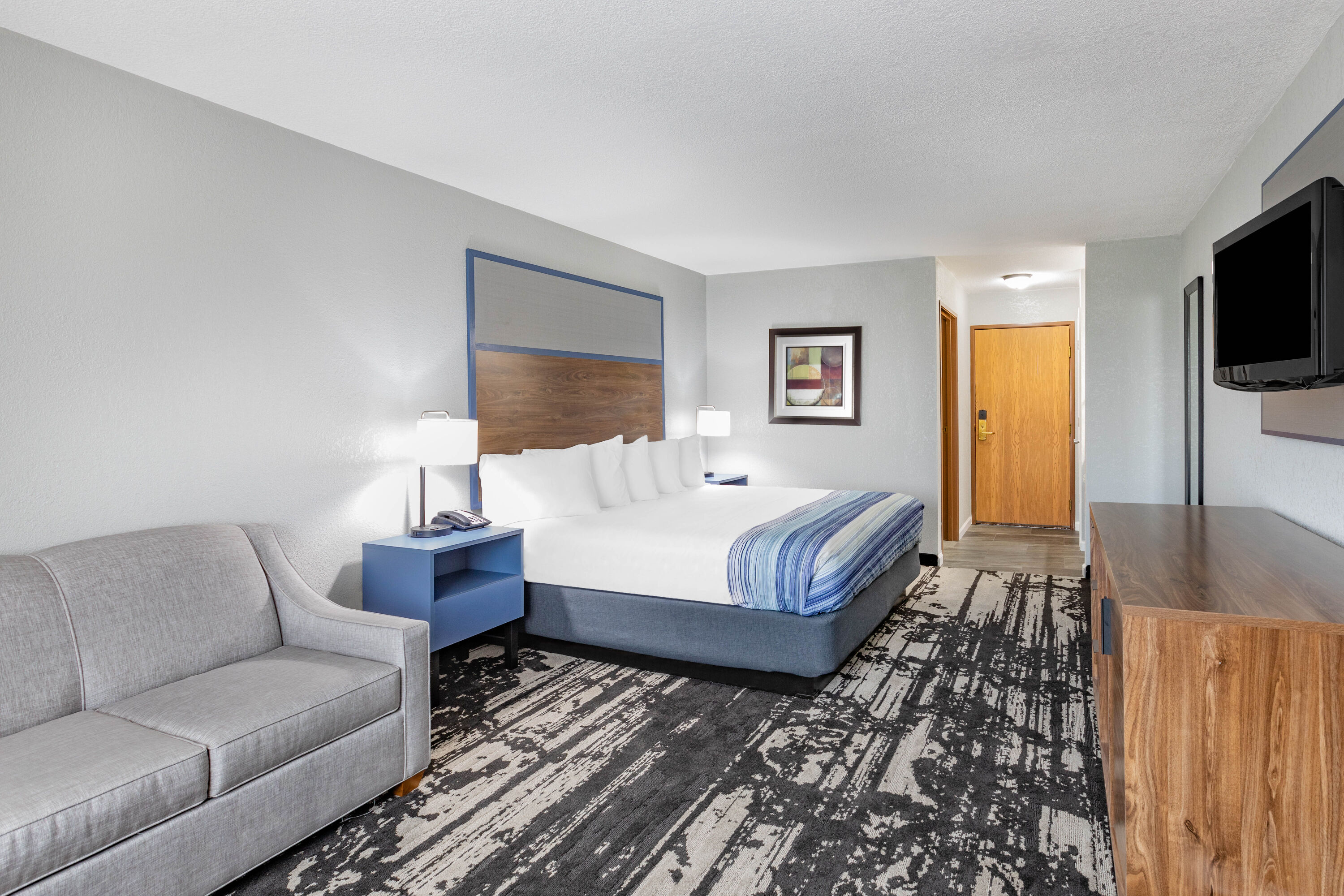 Guest room at the AmericInn by Wyndham Pella in Pella, Iowa