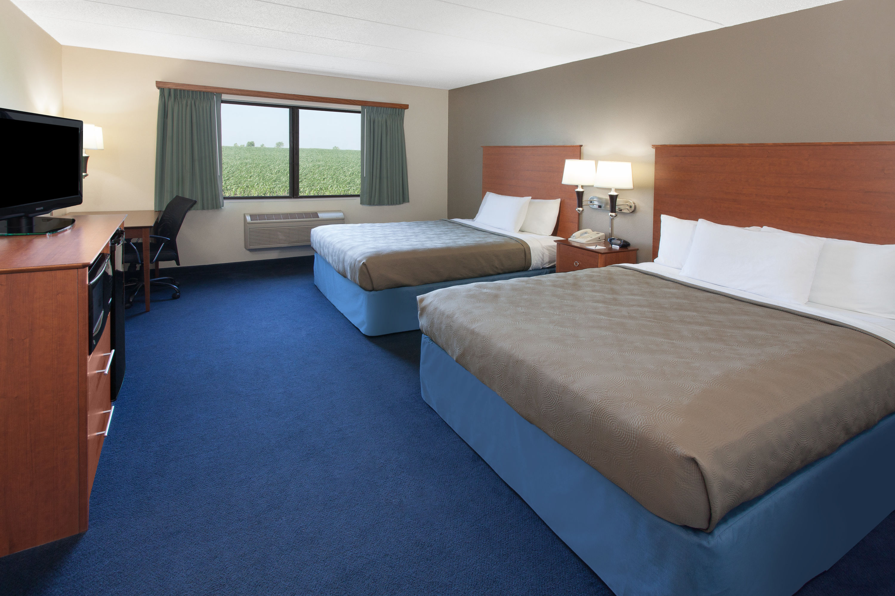 Guest room at the AmericInn by Wyndham Webster City in Webster City, Iowa