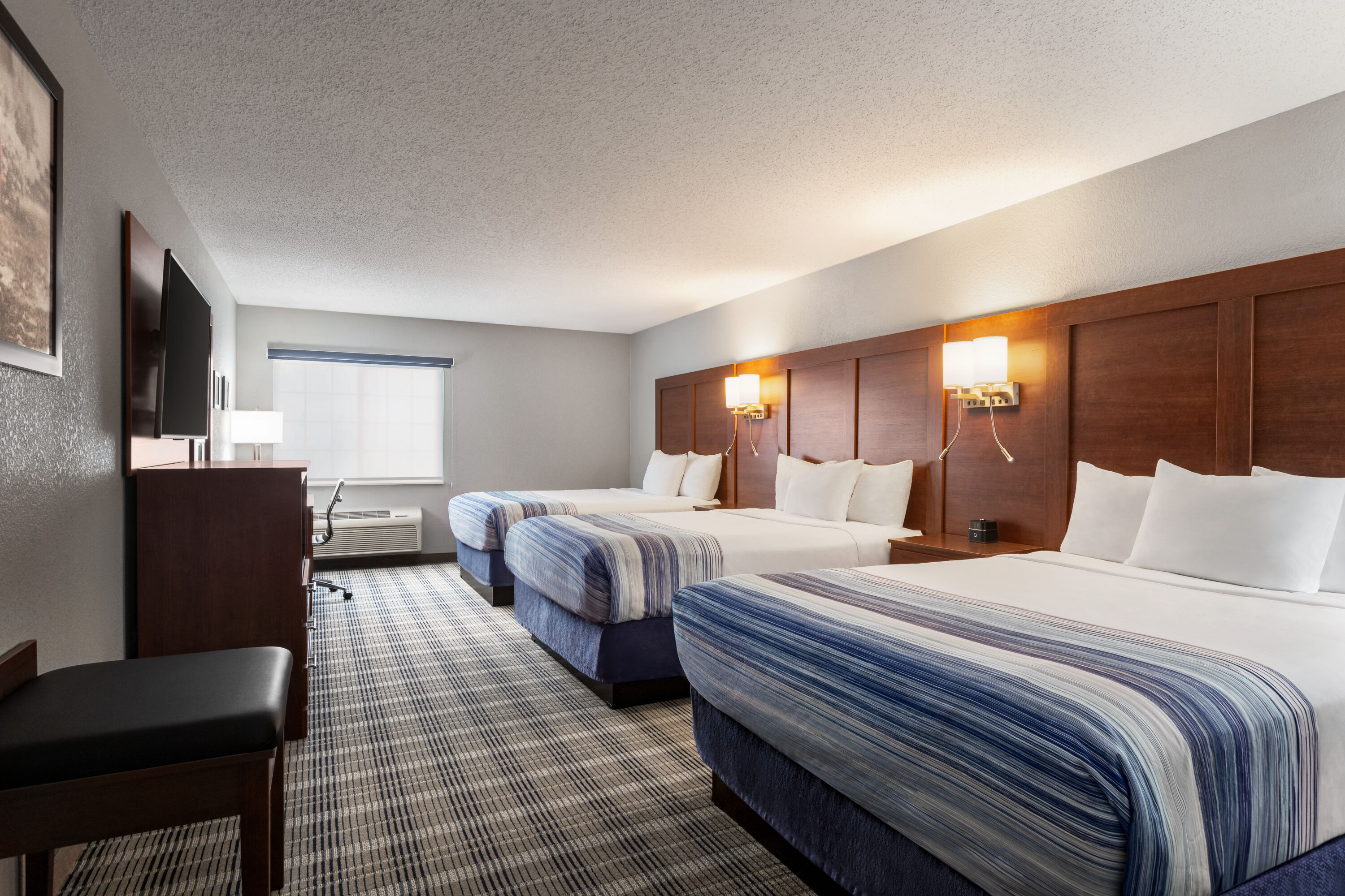 Guest room at the AmericInn by Wyndham Williamsburg in Williamsburg, Iowa