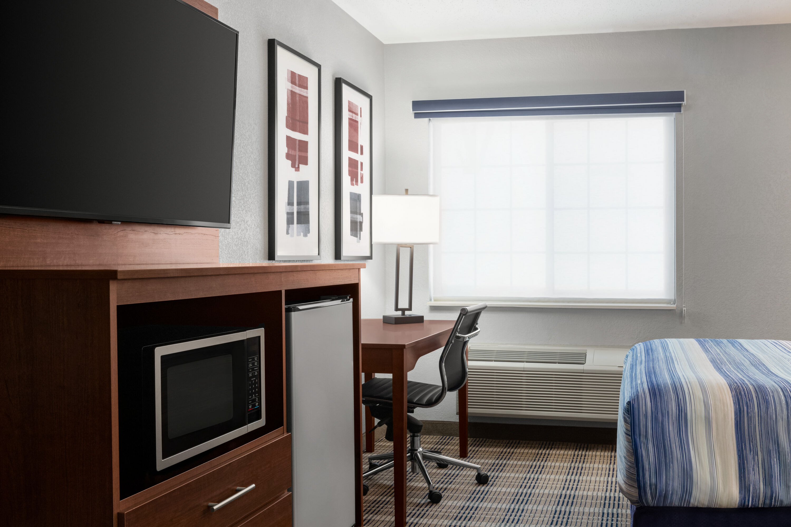 Guest room at the AmericInn by Wyndham Williamsburg in Williamsburg, Iowa
