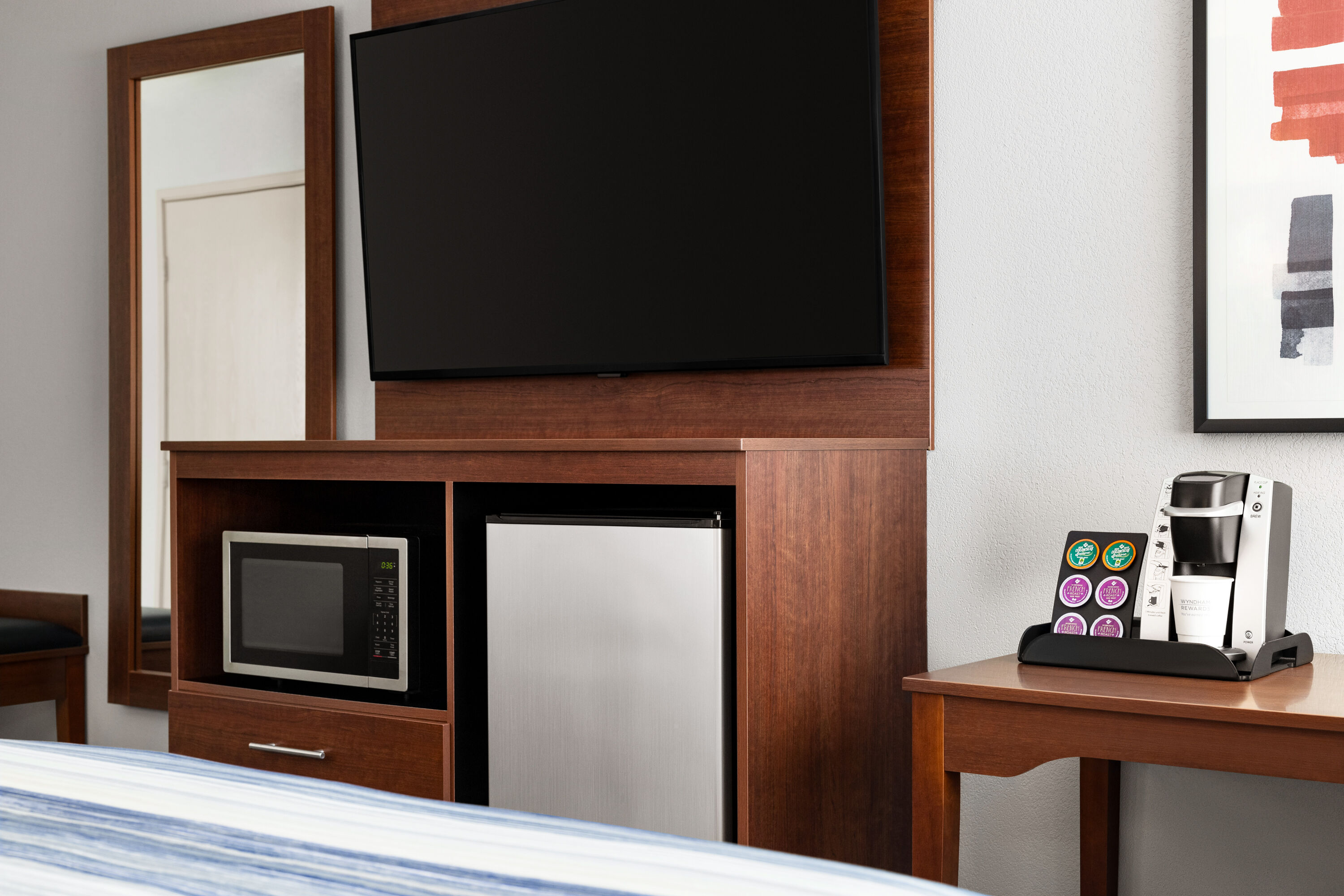 Guest room at the AmericInn by Wyndham Williamsburg in Williamsburg, Iowa