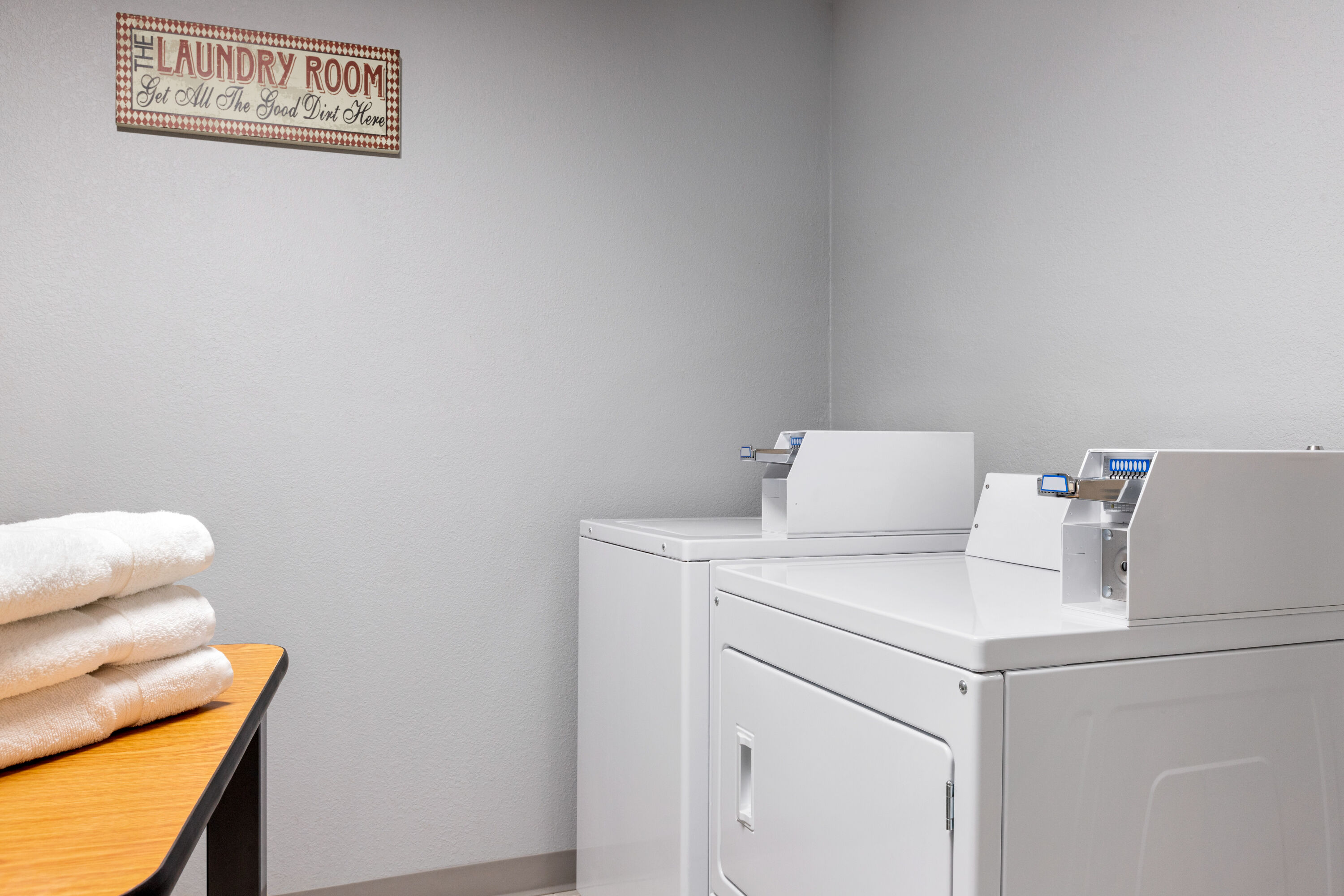 Laundry facilities at AmericInn by Wyndham Williamsburg in Williamsburg, Iowa