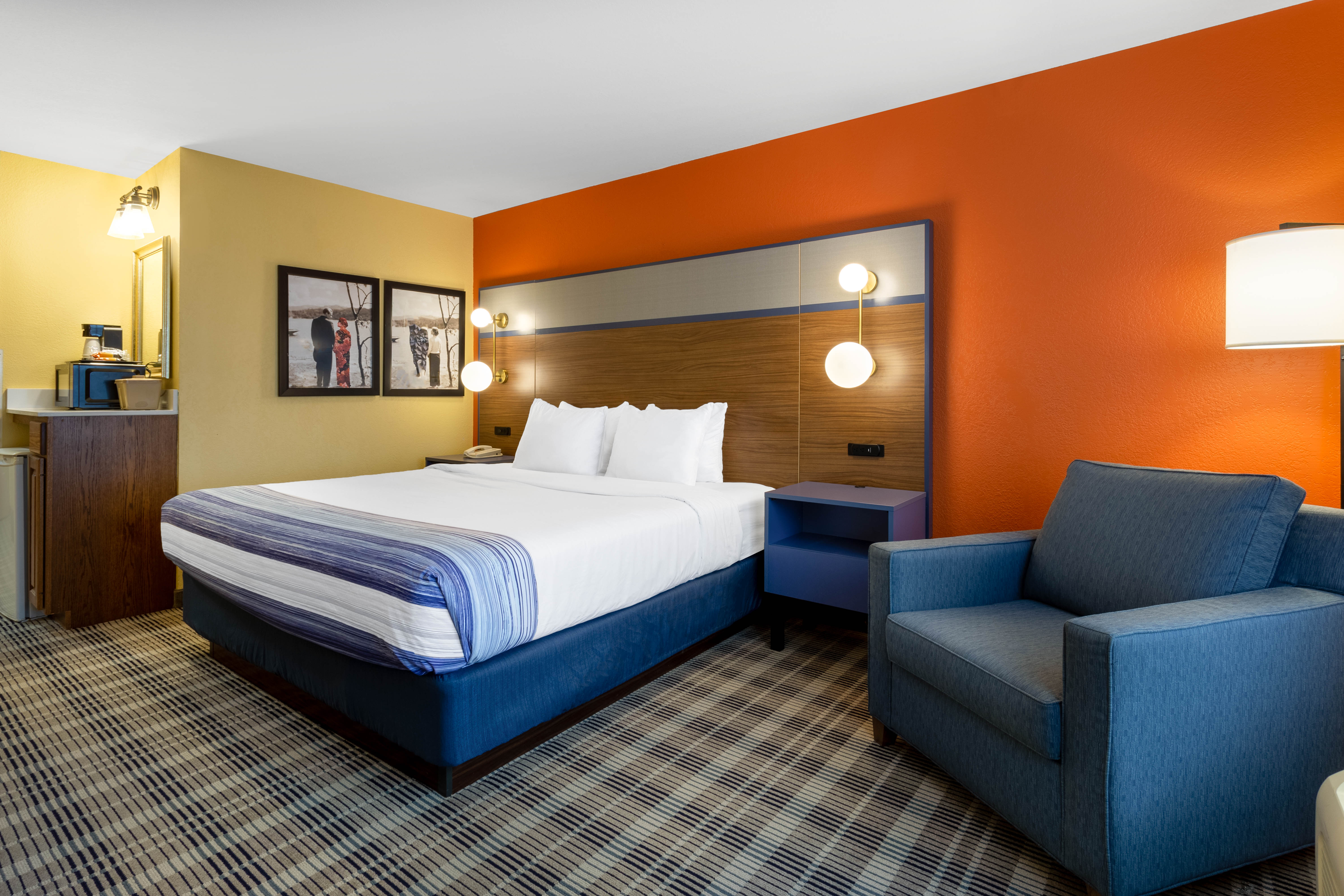 Guest room at the AmericInn by Wyndham Fulton Clinton in Fulton, Illinois