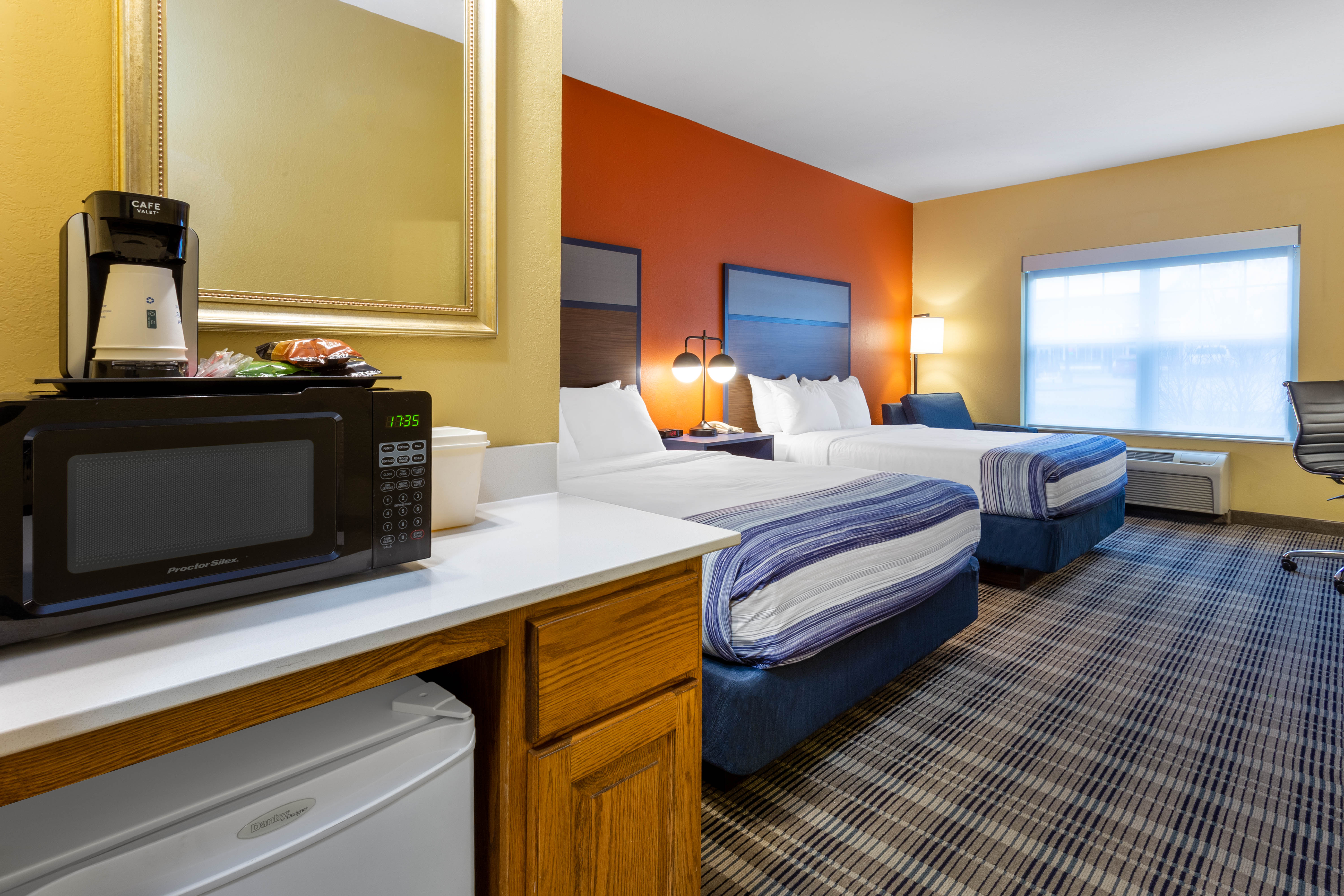 Guest room at the AmericInn by Wyndham Fulton Clinton in Fulton, Illinois