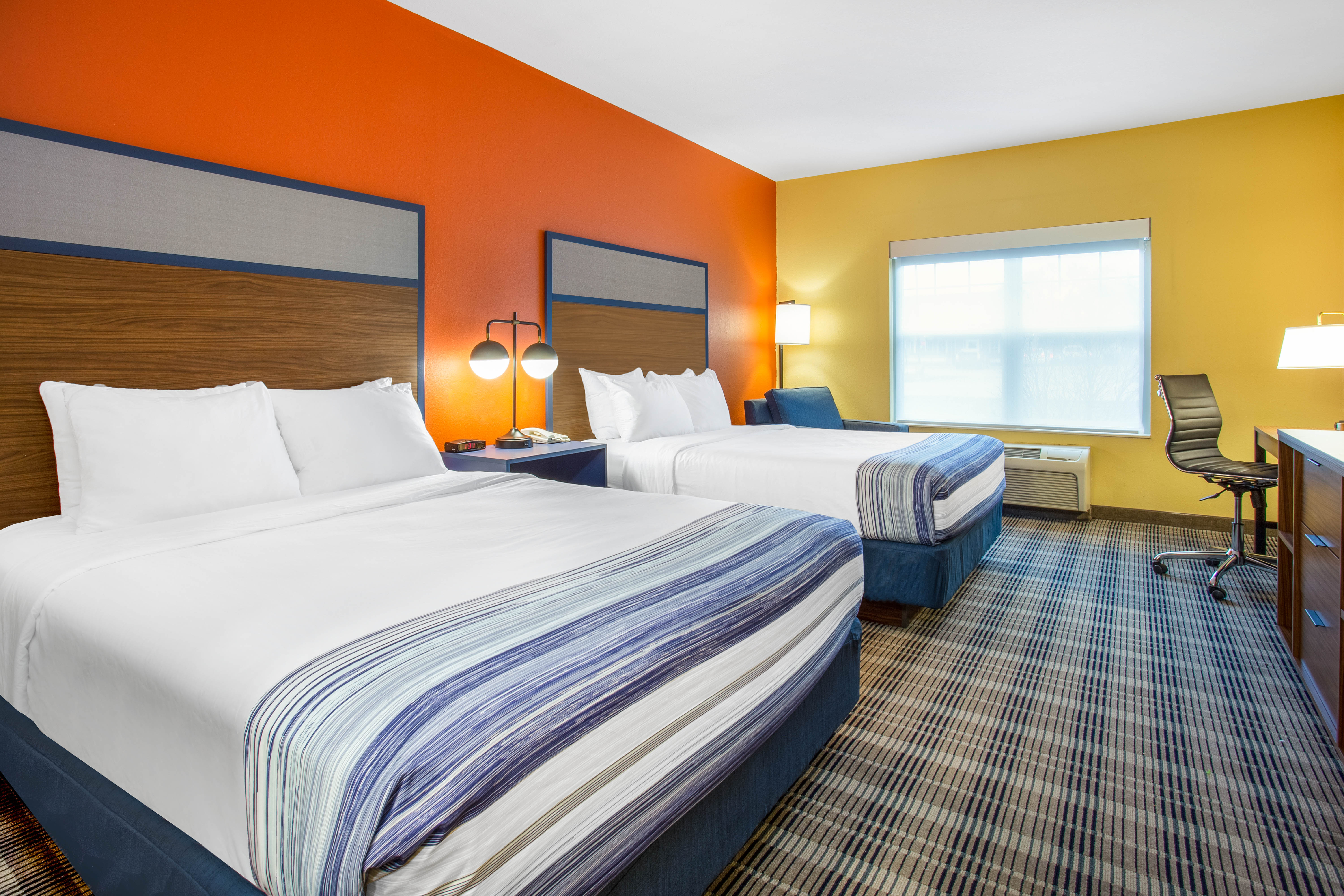 Guest room at the AmericInn by Wyndham Fulton Clinton in Fulton, Illinois