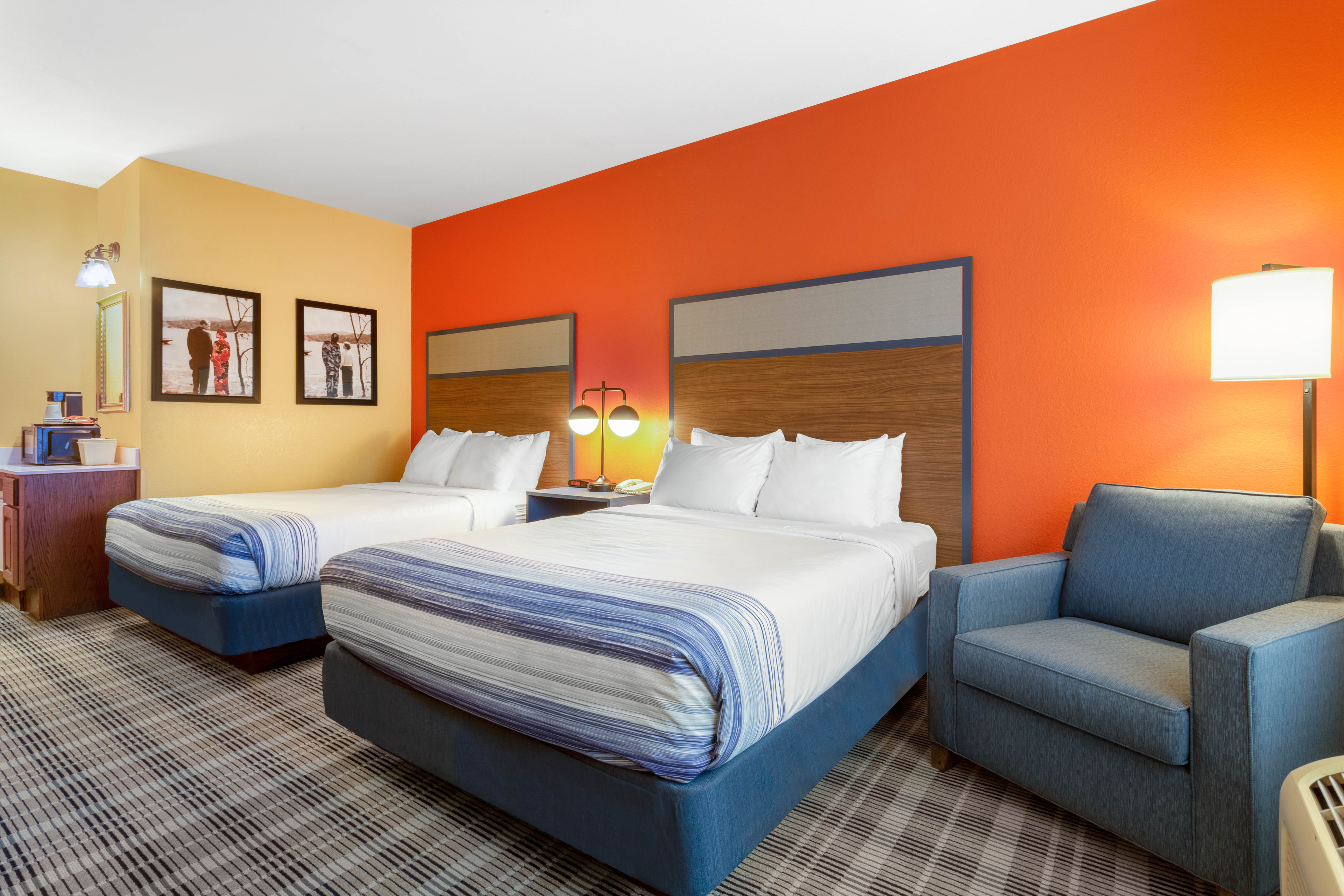 Guest room at the AmericInn by Wyndham Fulton Clinton in Fulton, Illinois
