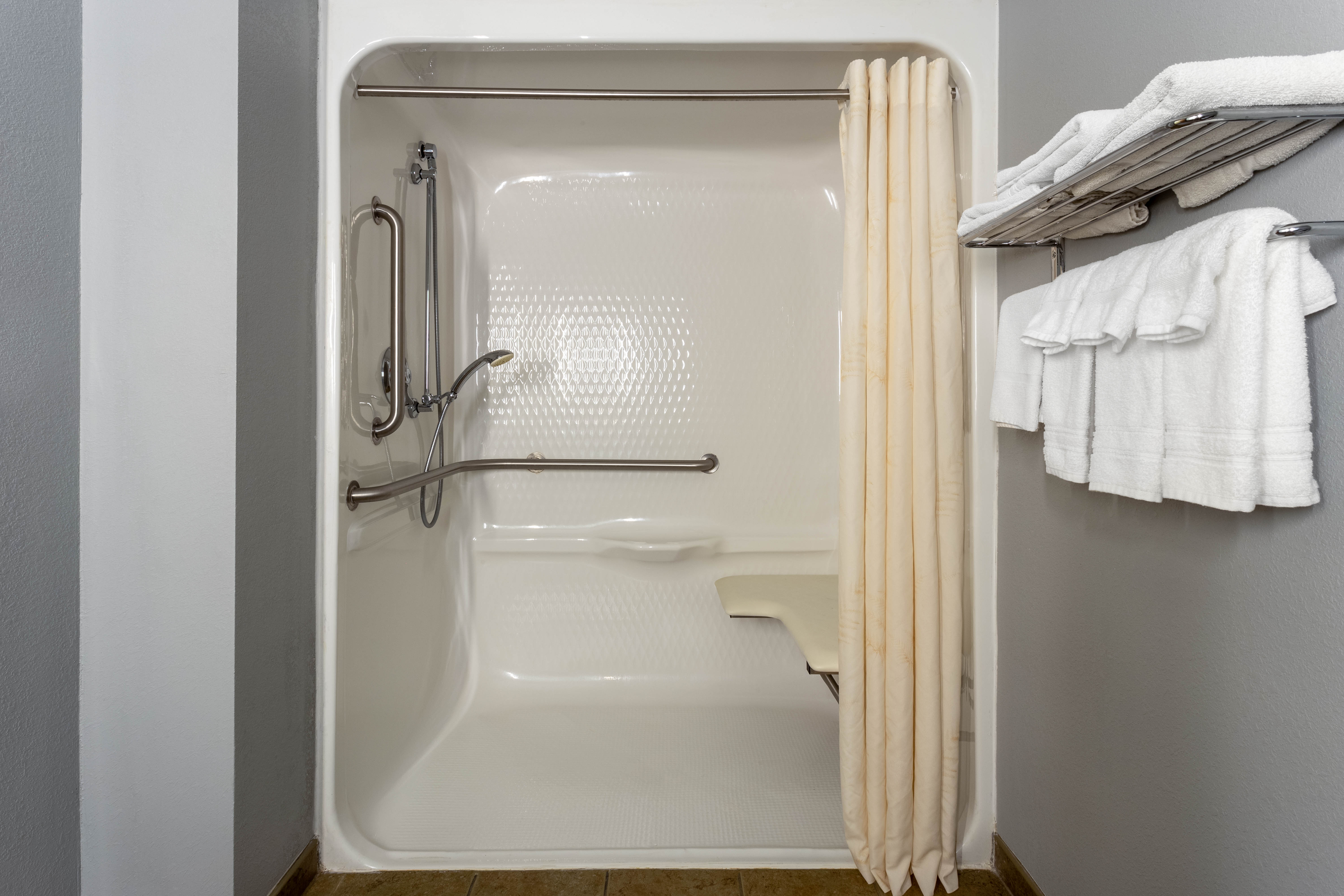 Guest room bath at the AmericInn by Wyndham Fulton Clinton in Fulton, Illinois
