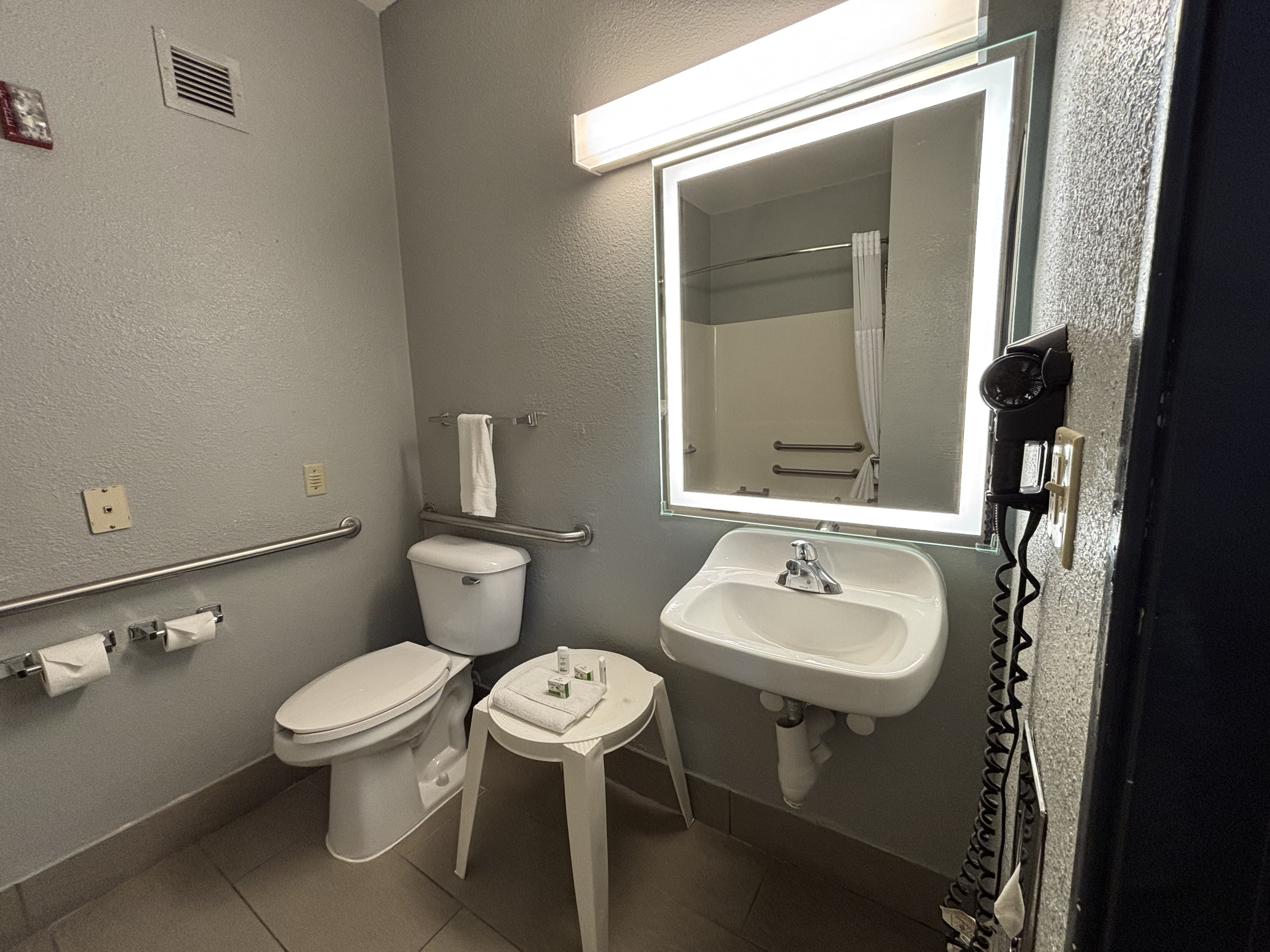 Guest room bath at the AmericInn by Wyndham Galesburg in Galesburg, Illinois