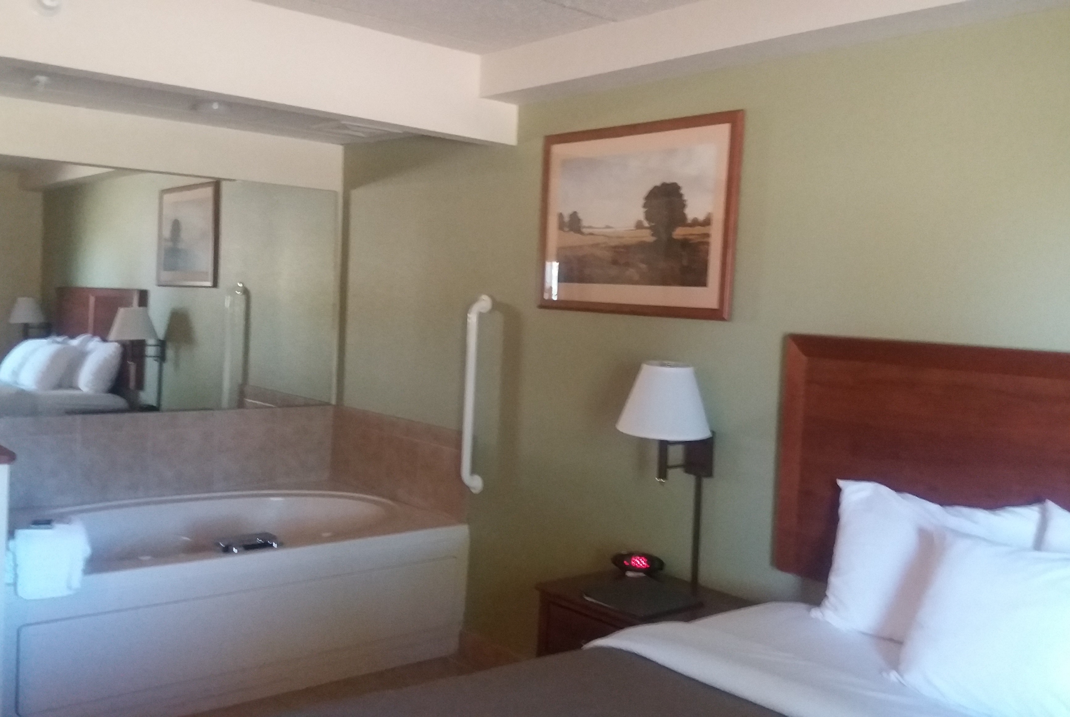 Guest room bath at the AmericInn by Wyndham Kewanee in Kewanee, Illinois