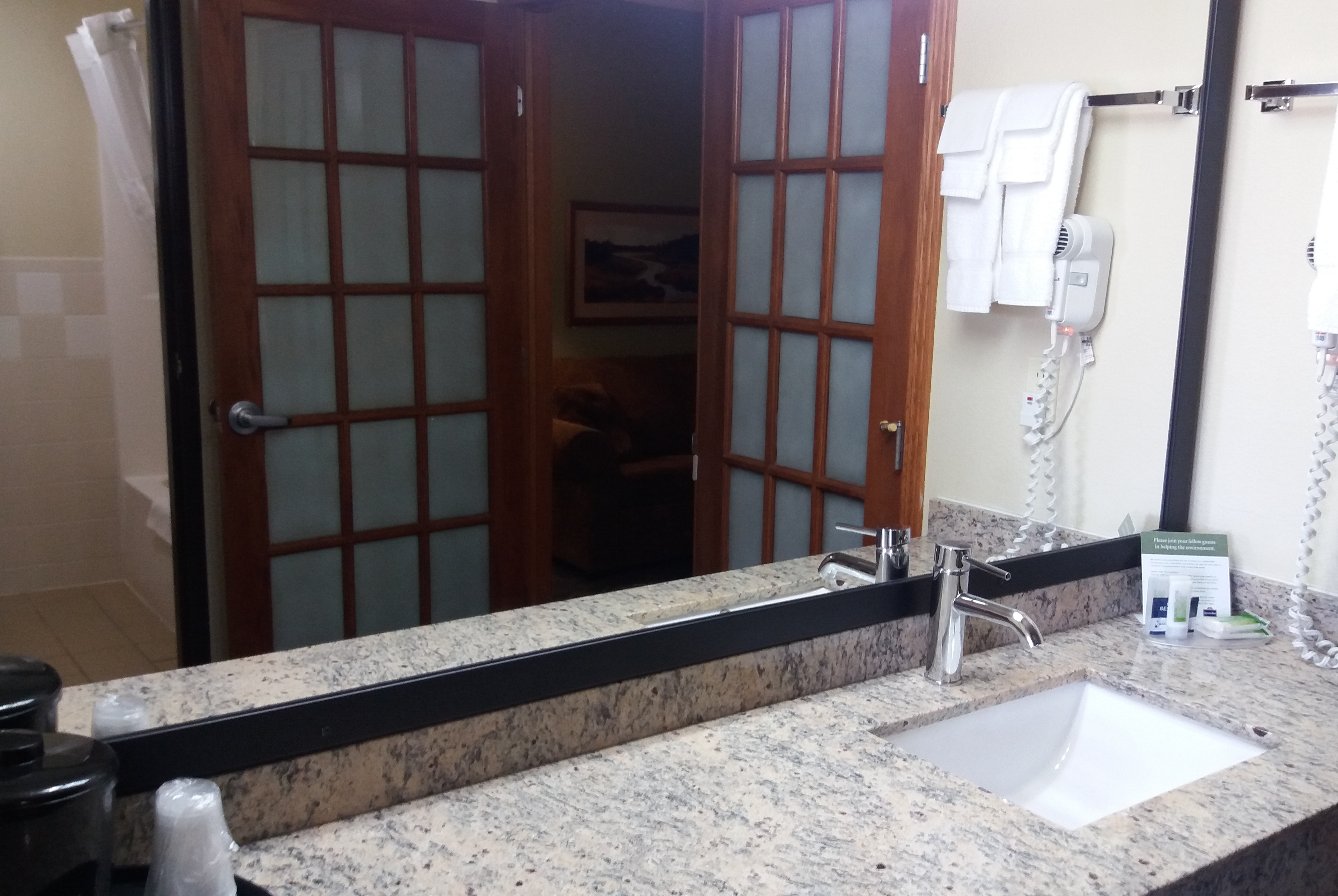 Guest room bath at the AmericInn by Wyndham Kewanee in Kewanee, Illinois