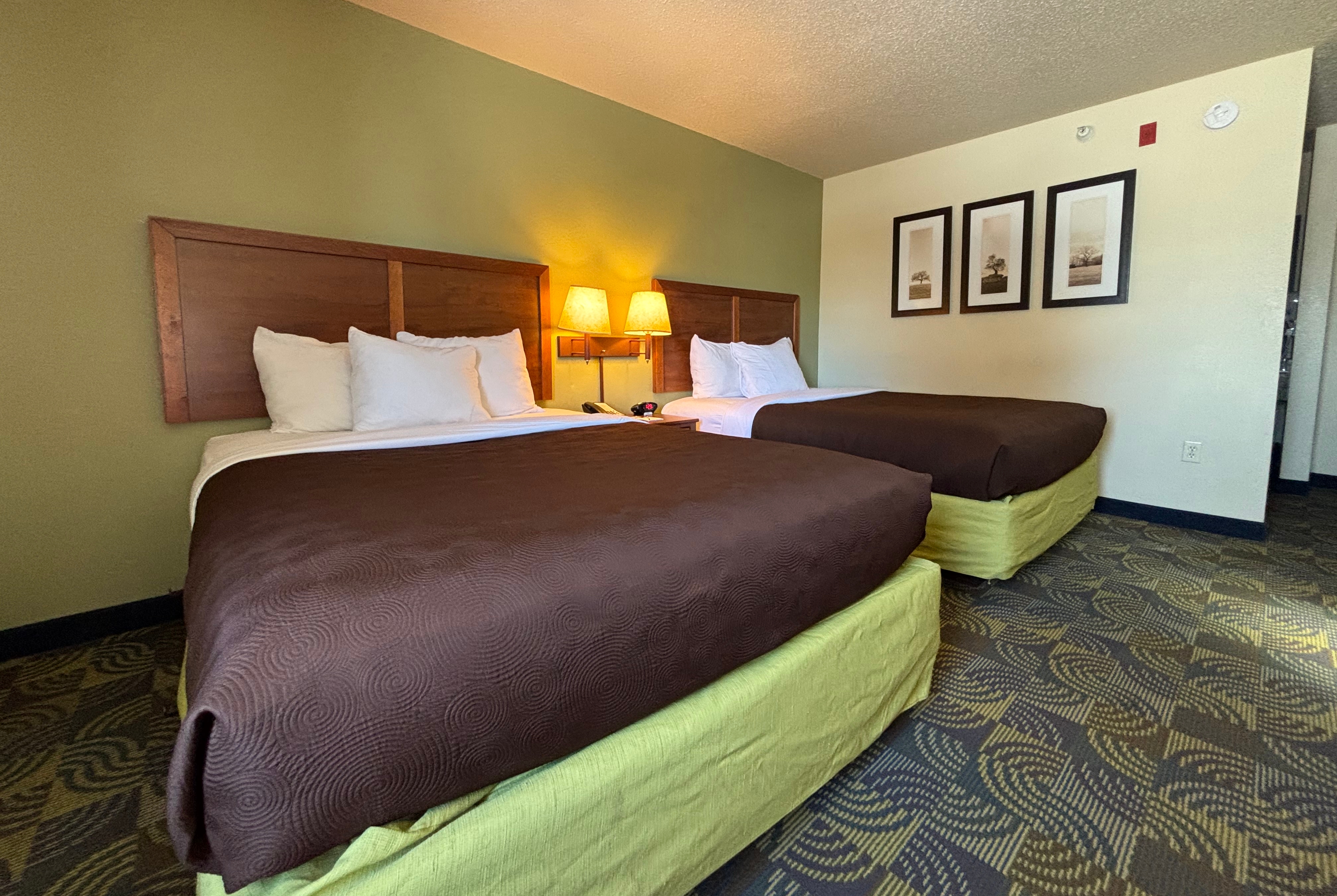 Guest room at the AmericInn by Wyndham Kewanee in Kewanee, Illinois
