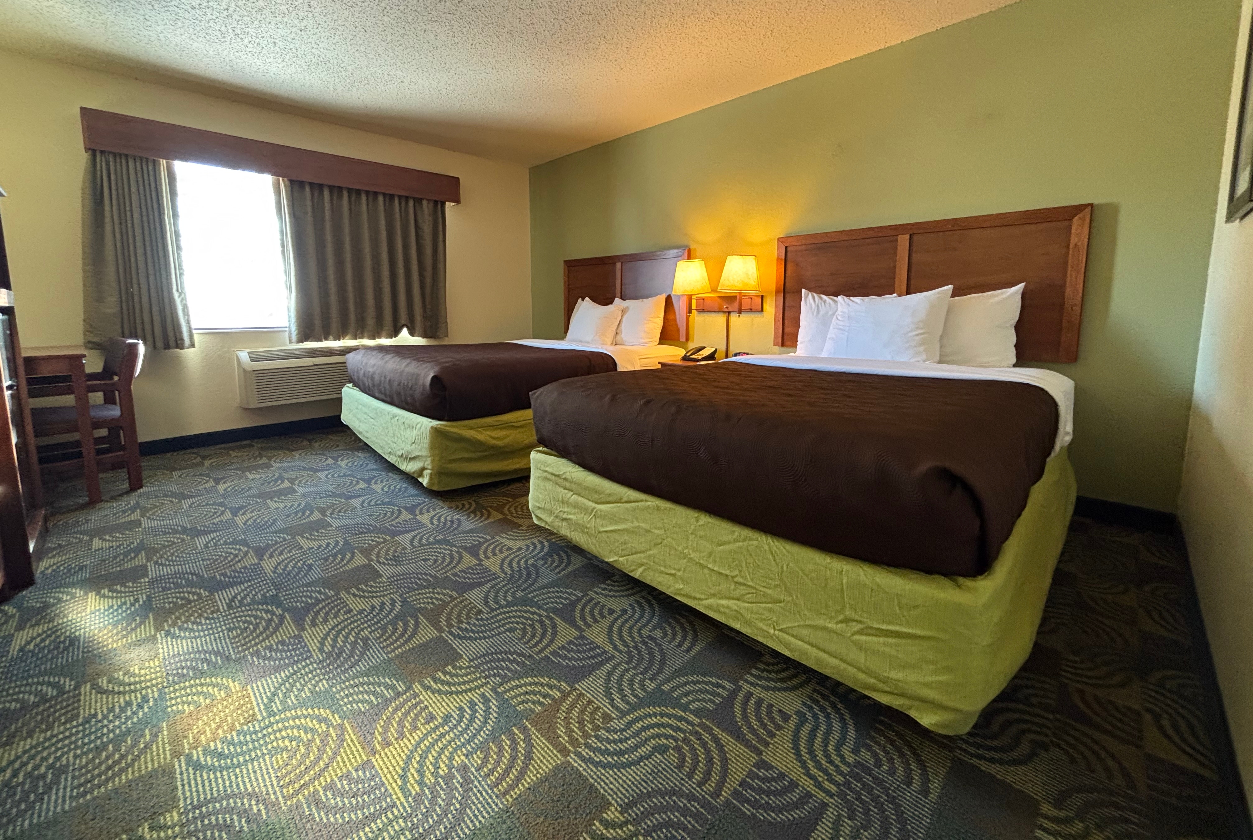 Guest room at the AmericInn by Wyndham Kewanee in Kewanee, Illinois