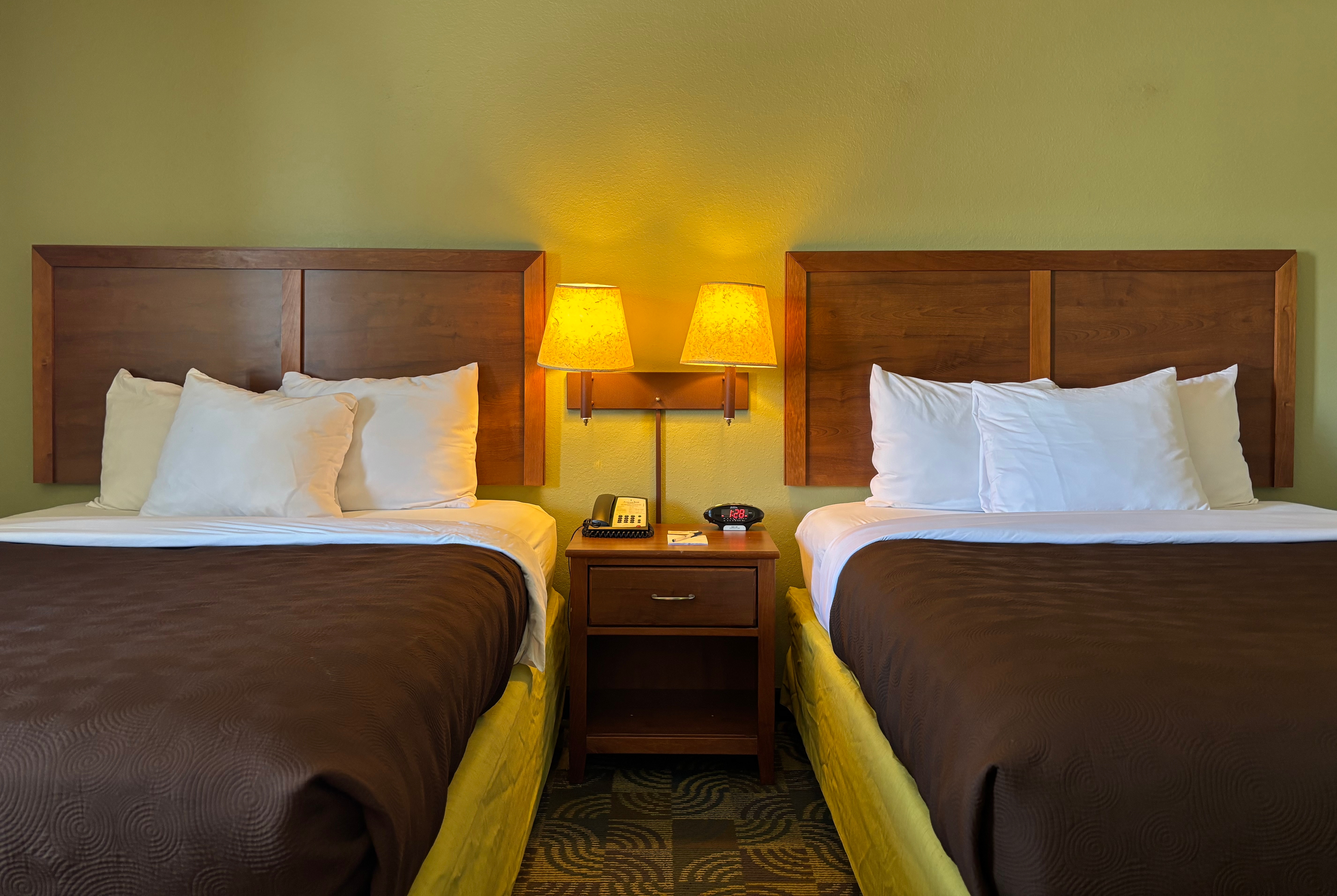 Guest room at the AmericInn by Wyndham Kewanee in Kewanee, Illinois
