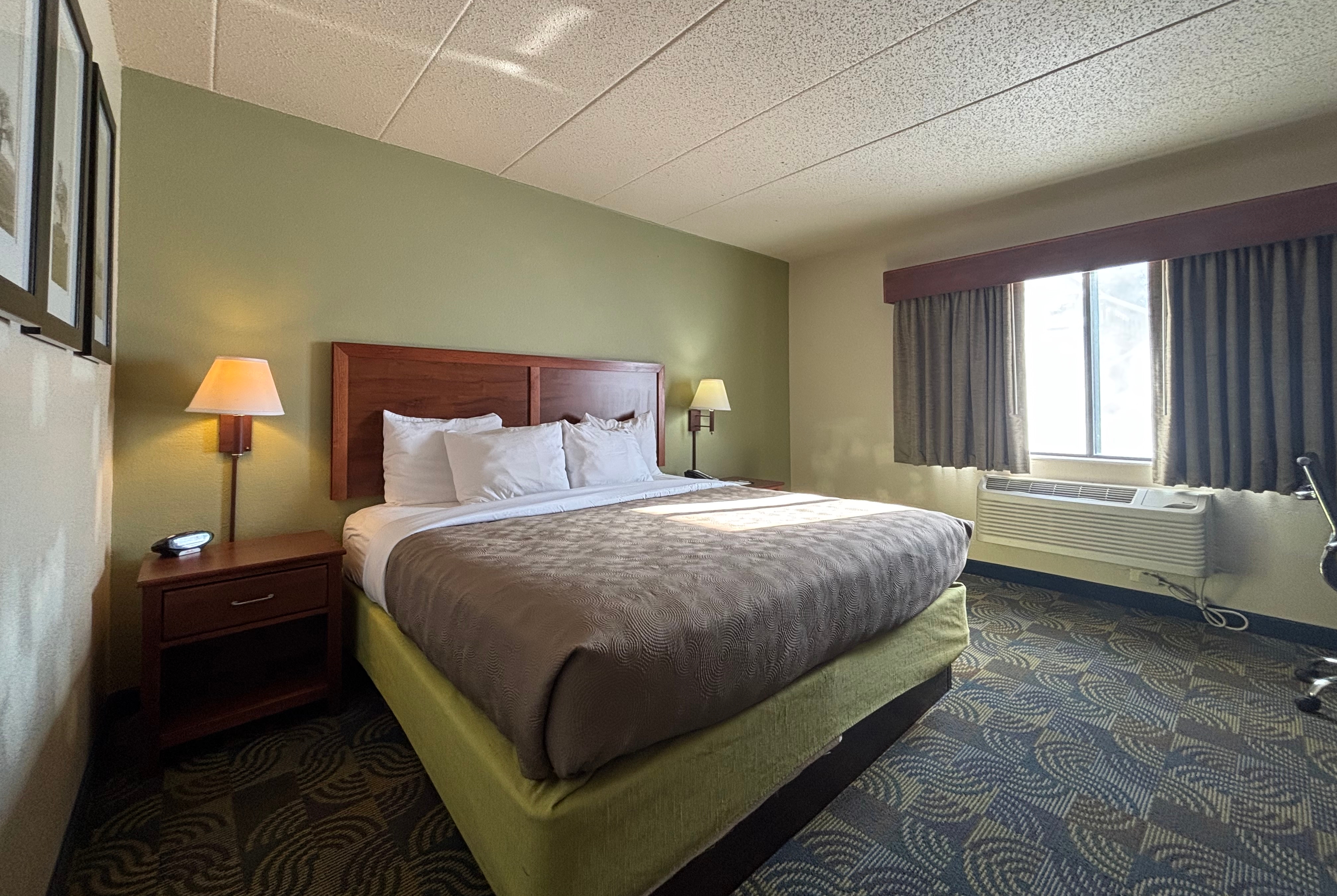 Guest room at the AmericInn by Wyndham Kewanee in Kewanee, Illinois