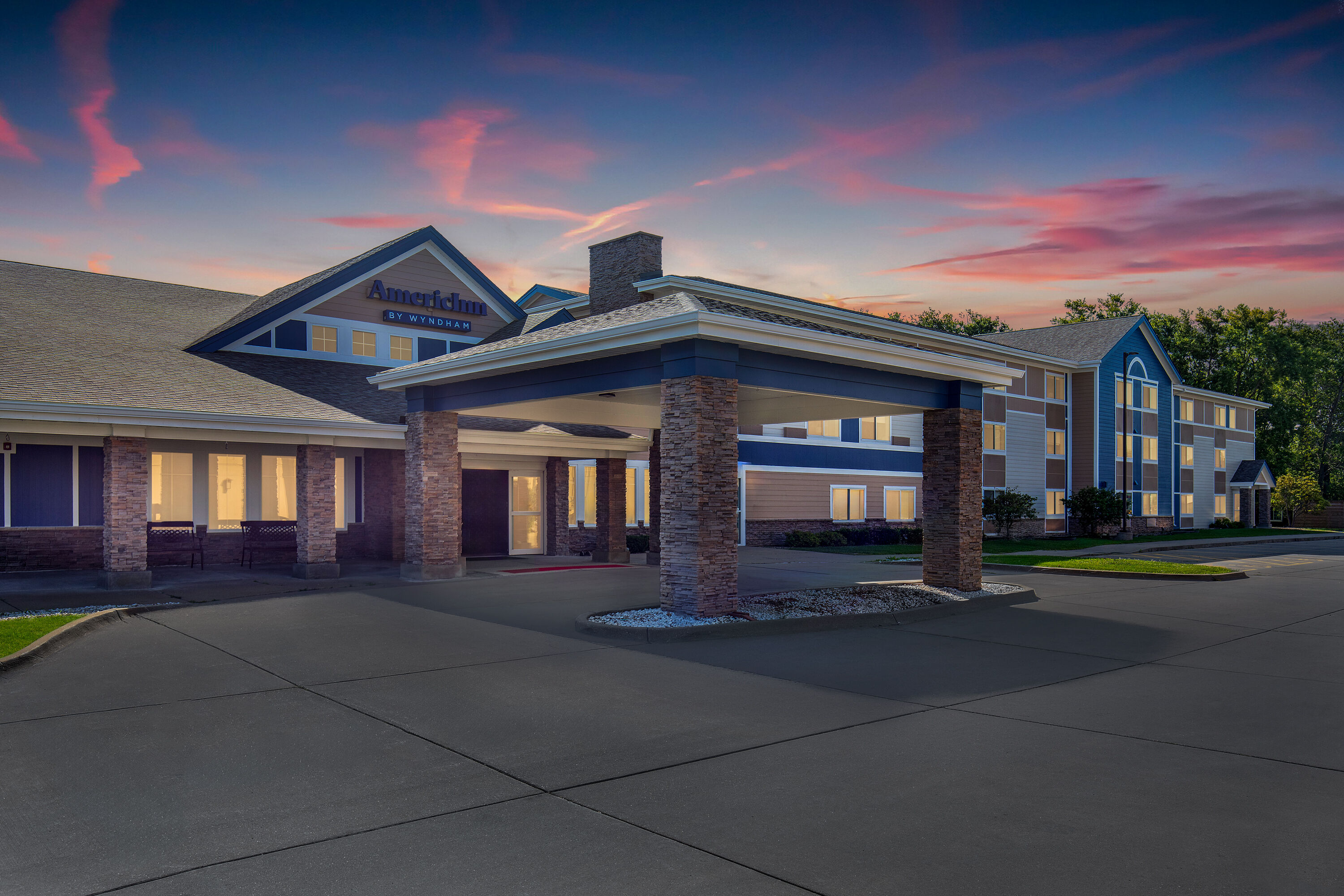 Exterior Dusk Image of AmericInn by Wyndham Monmouth hotel in Monmouth, Illinois
