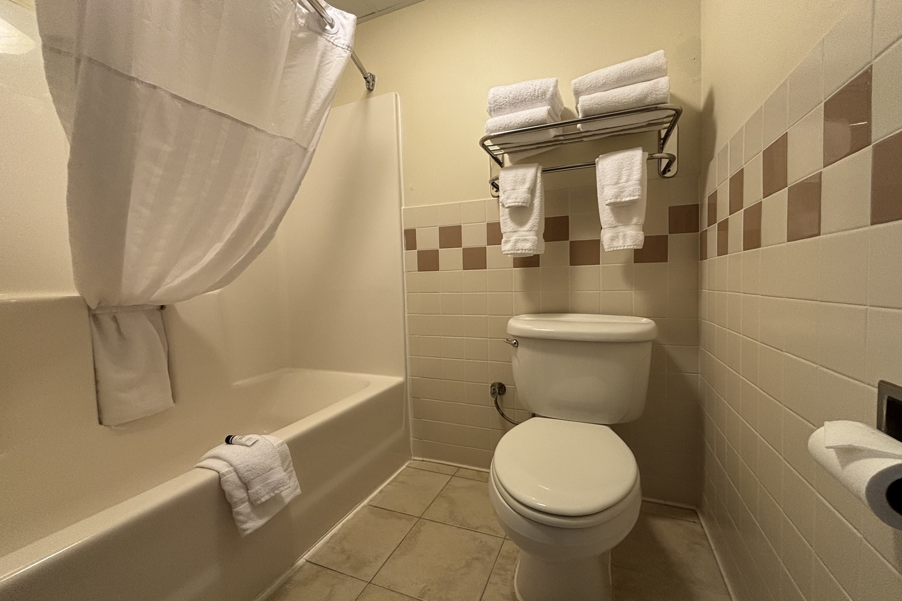 Guest room bath at the AmericInn by Wyndham Monmouth in Monmouth, Illinois