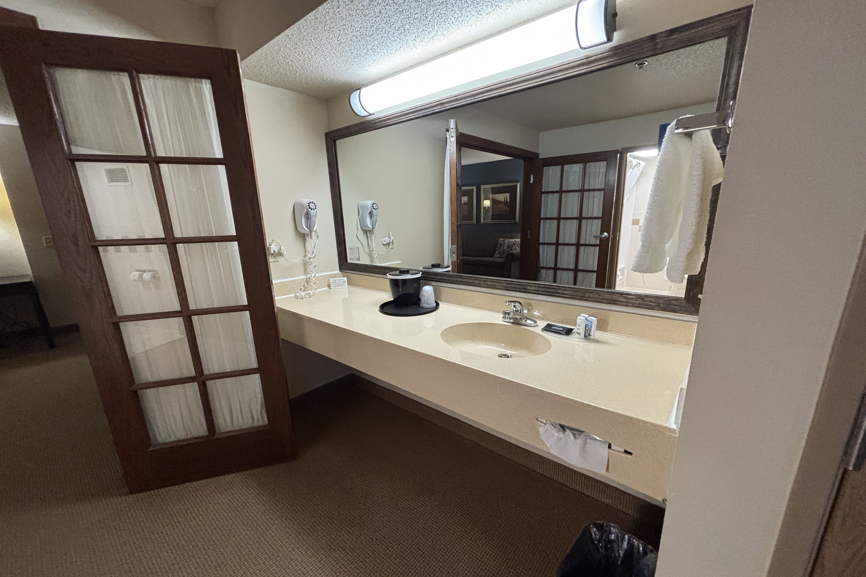 Guest room bath at the AmericInn by Wyndham Monmouth in Monmouth, Illinois