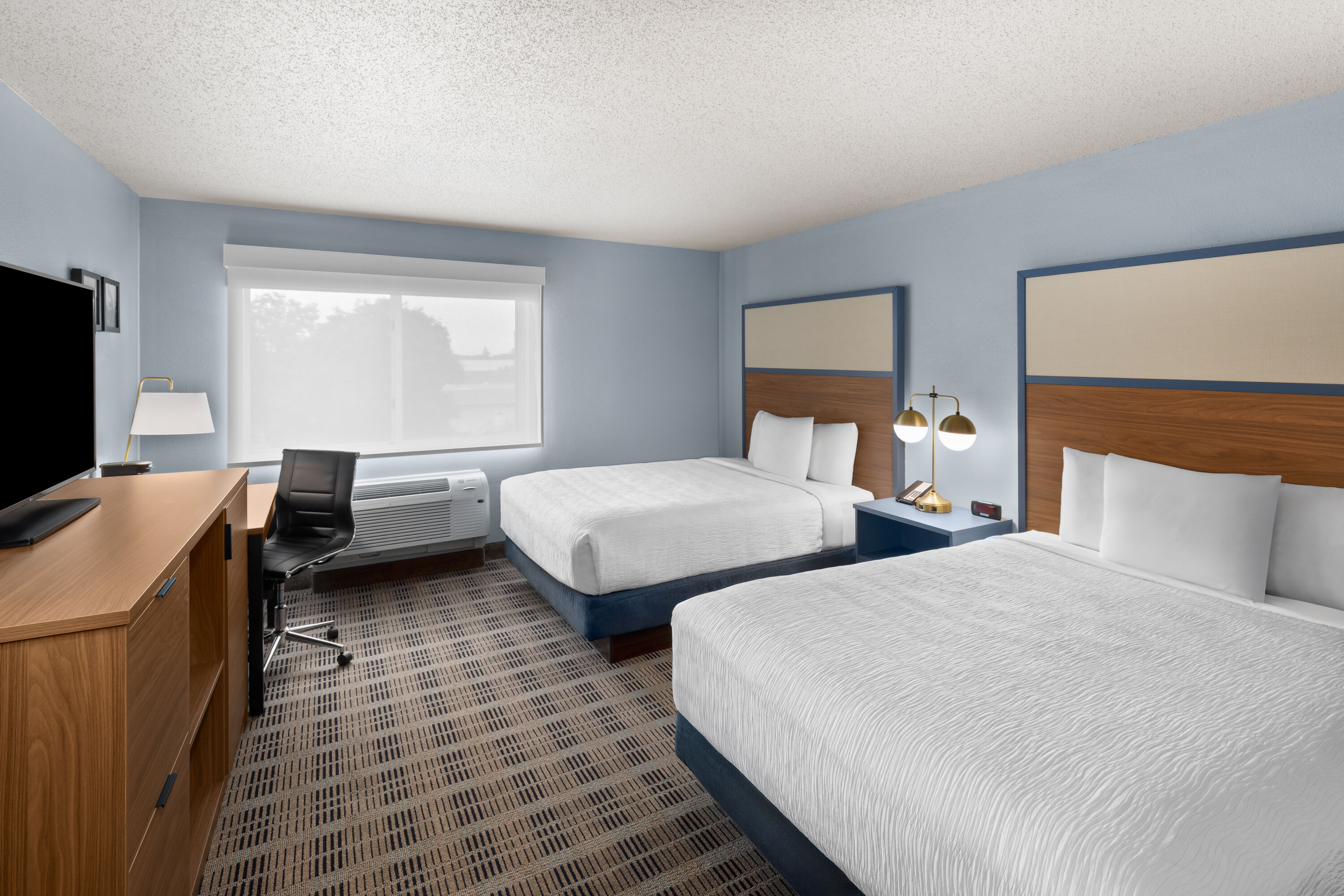 Guest room at the AmericInn by Wyndham Monmouth in Monmouth, Illinois