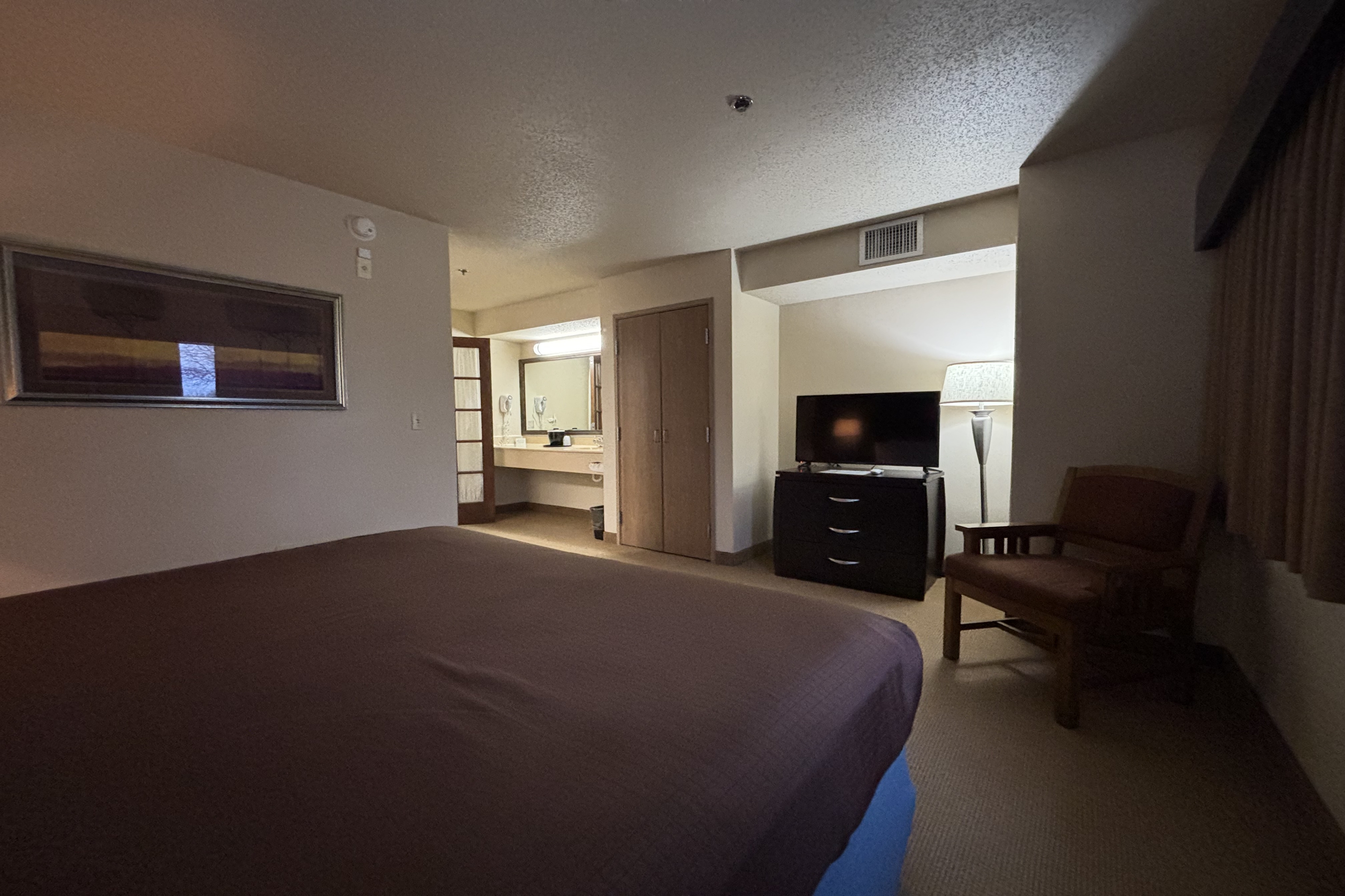 Guest room at the AmericInn by Wyndham Monmouth in Monmouth, Illinois