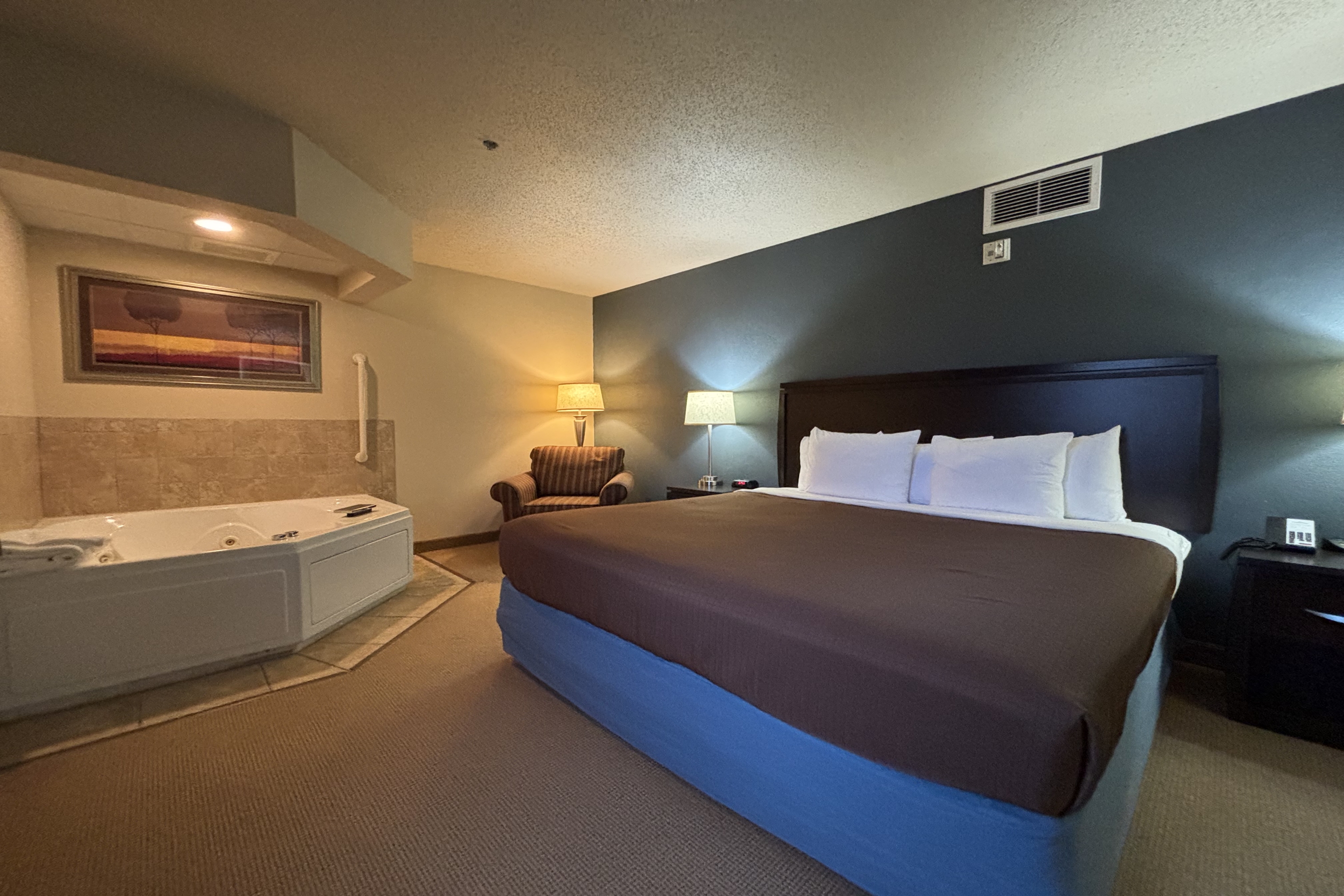 Guest room at the AmericInn by Wyndham Monmouth in Monmouth, Illinois