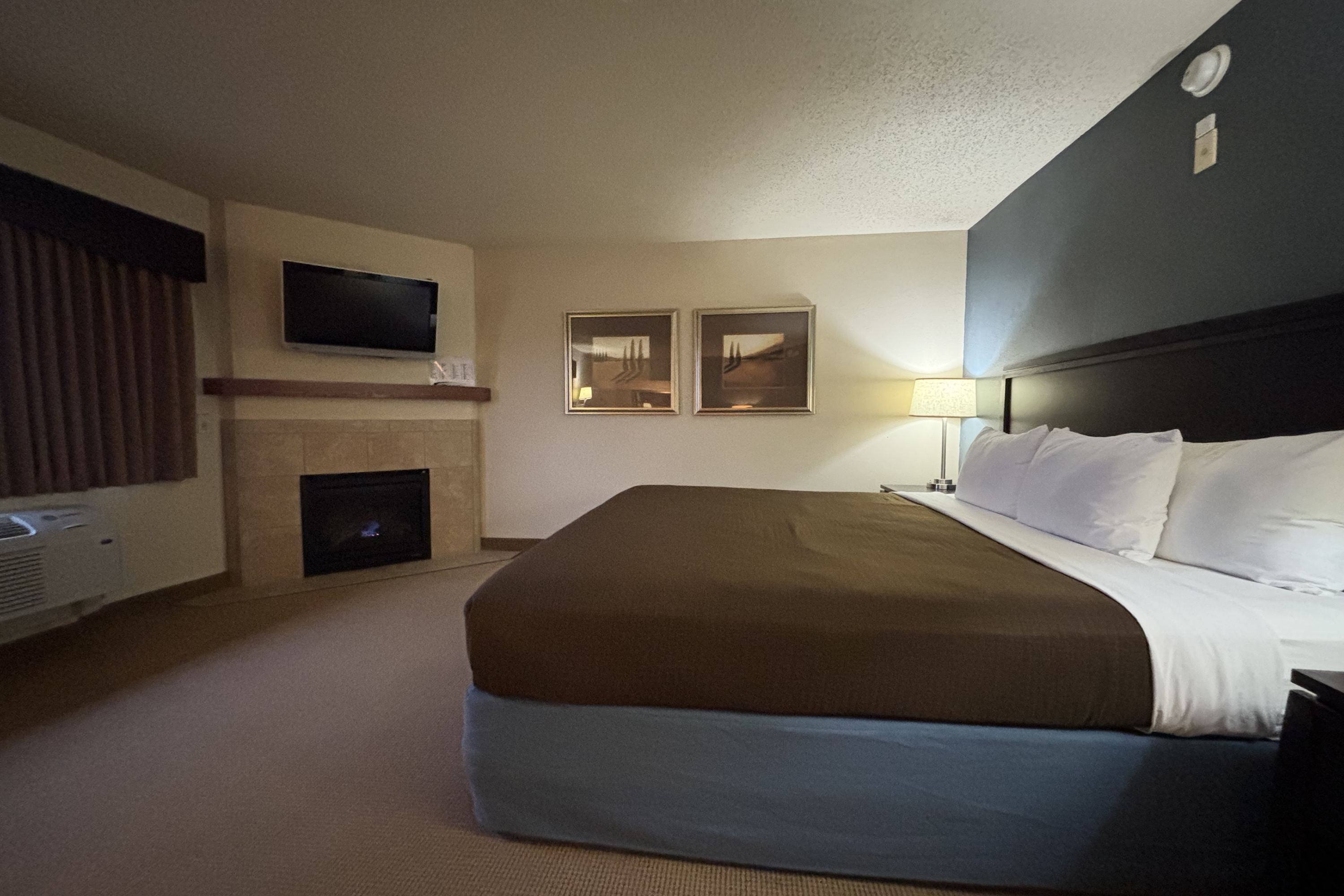 Guest room at the AmericInn by Wyndham Monmouth in Monmouth, Illinois