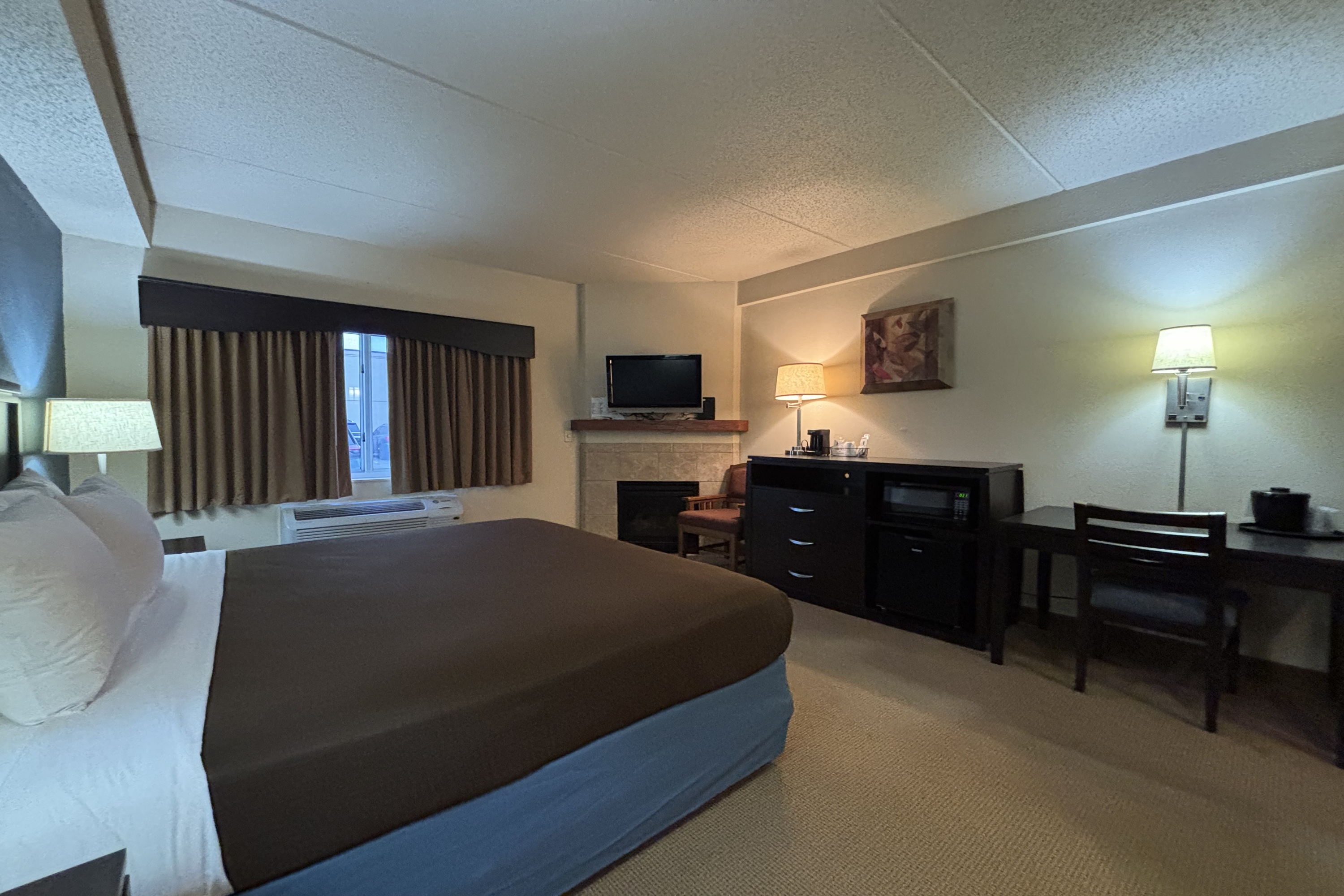 Guest room at the AmericInn by Wyndham Monmouth in Monmouth, Illinois