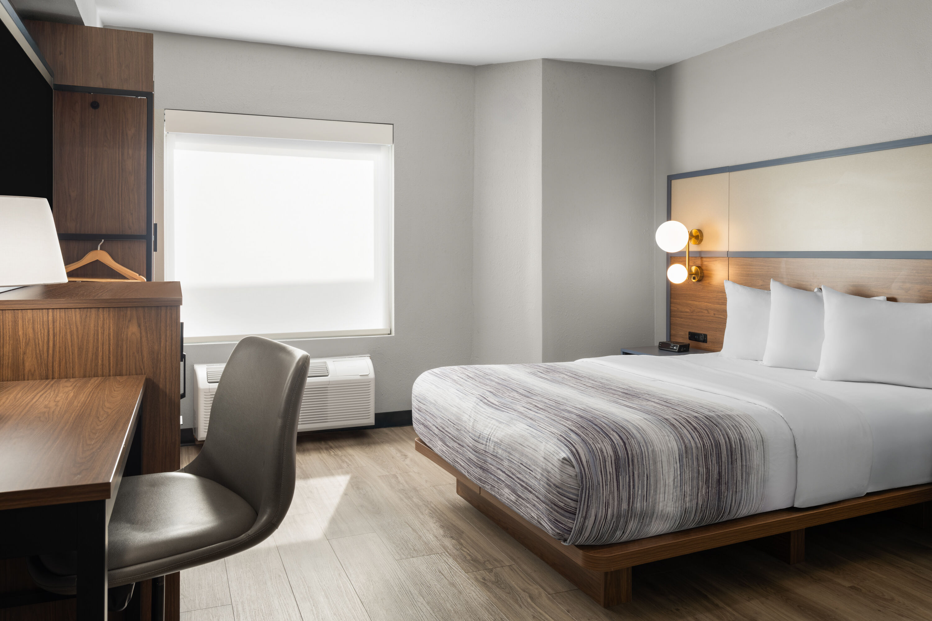 Guest room at the AmericInn by Wyndham Urbana/Champaign University Area in Urbana, Illinois