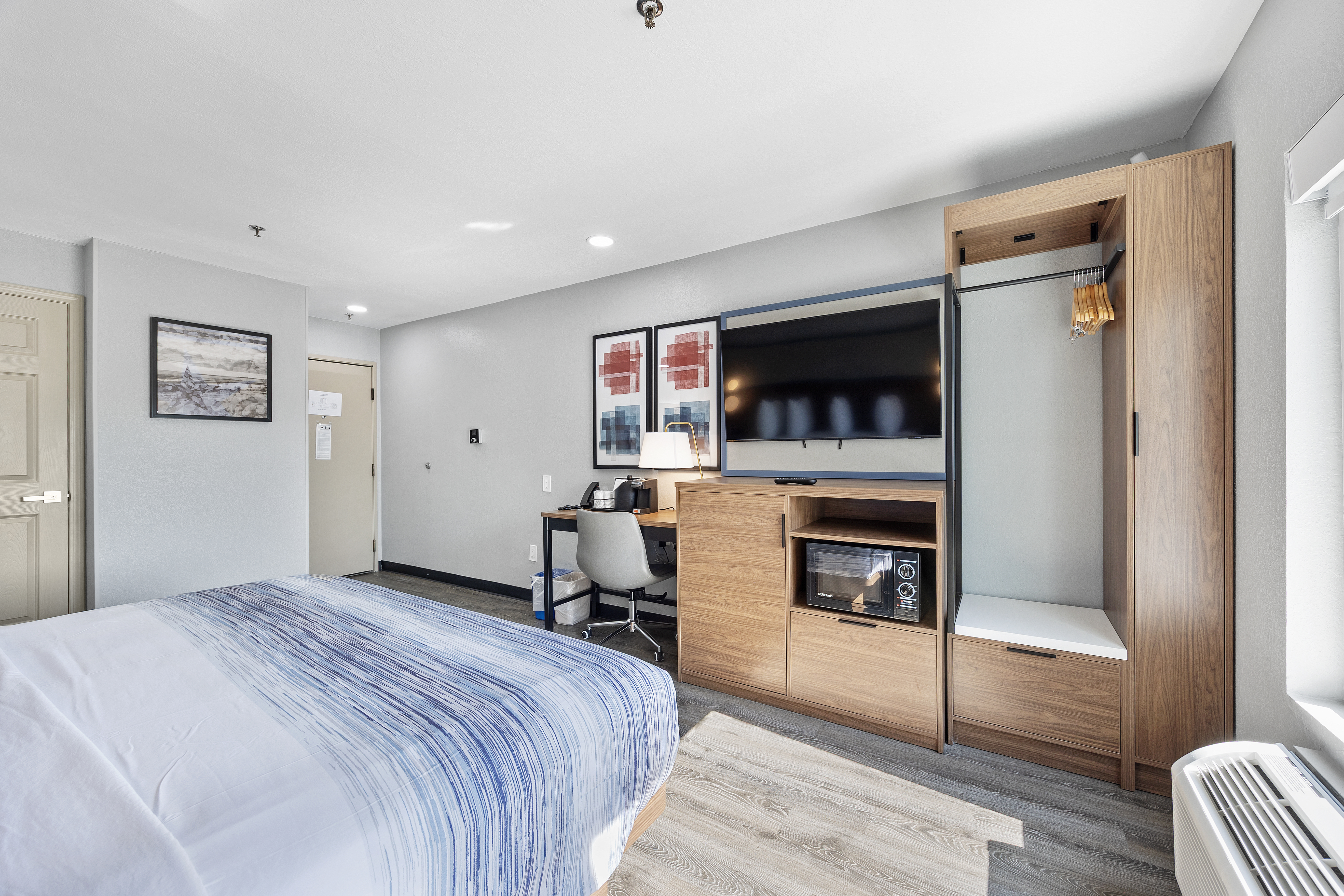 Guest room at the AmericInn by Wyndham Urbana/Champaign University Area in Urbana, Illinois