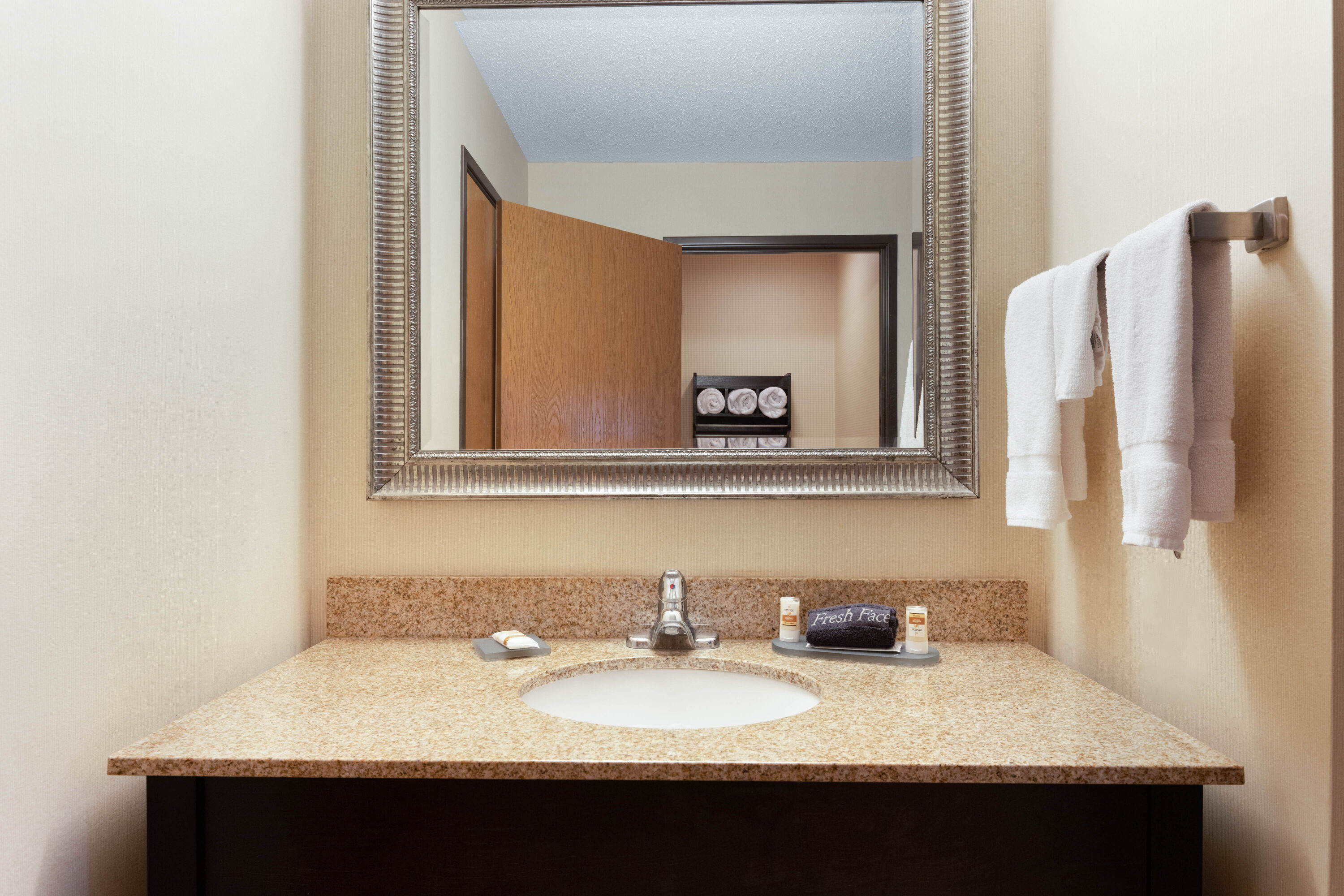 Guest room bath at the AmericInn by Wyndham Frankfort IN in Frankfort, Indiana