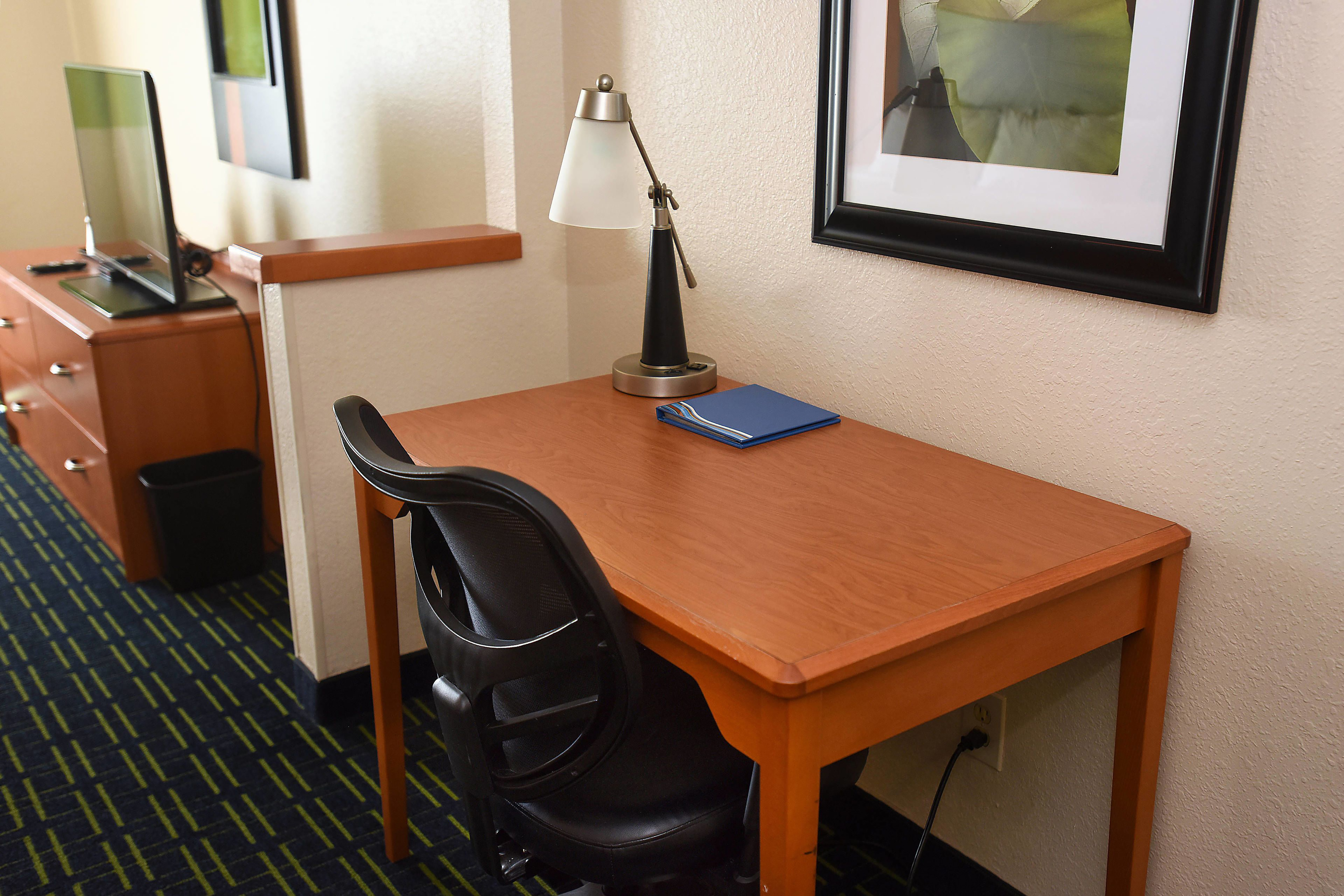 Guest room at the AmericInn by Wyndham Topeka in Topeka, Kansas